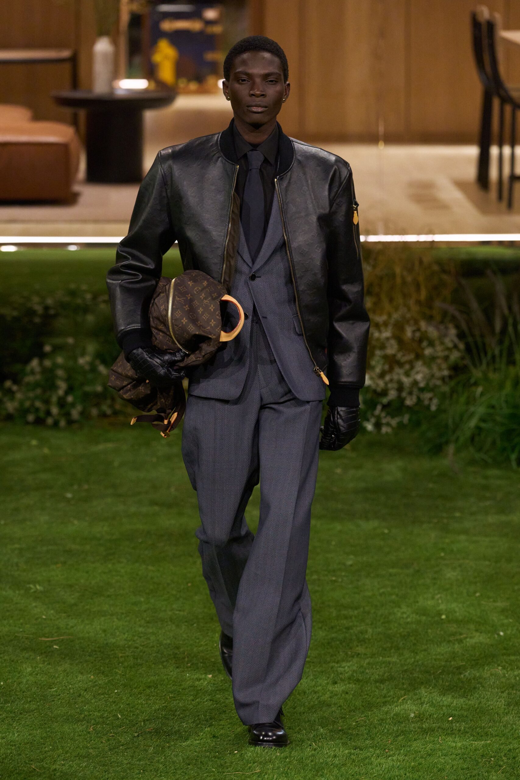 black leather jacket with gray suit