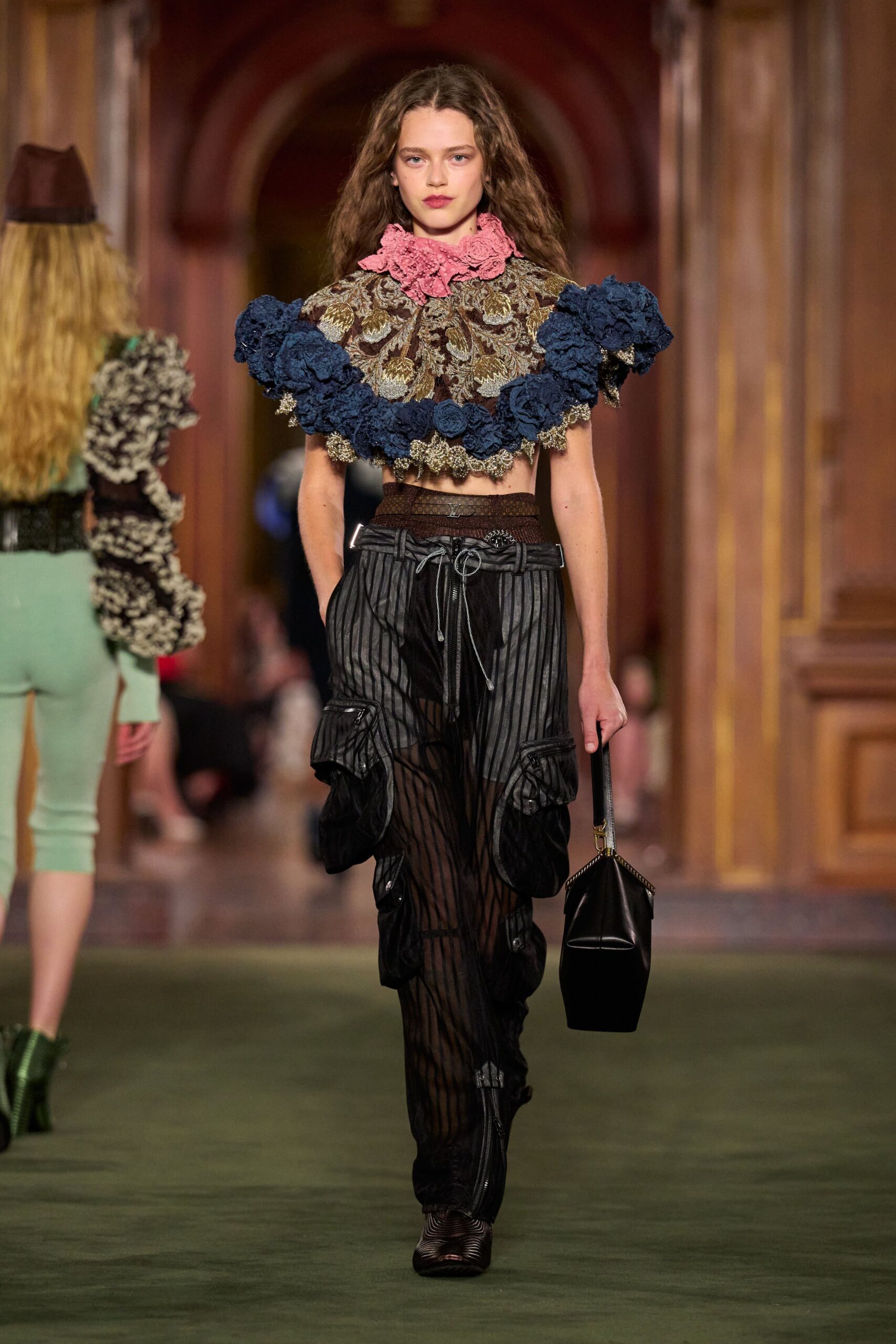 black ruffled top with relaxed pants