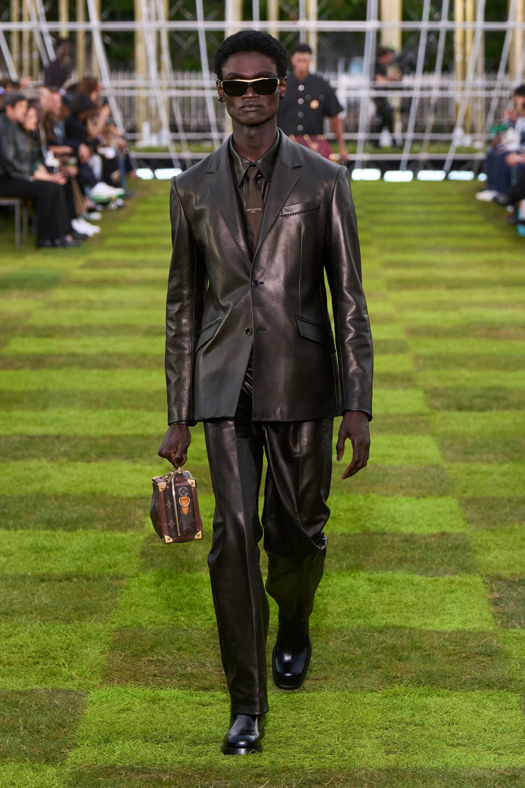 black leather long-sleeve collared fitted buttoned shiny suit
