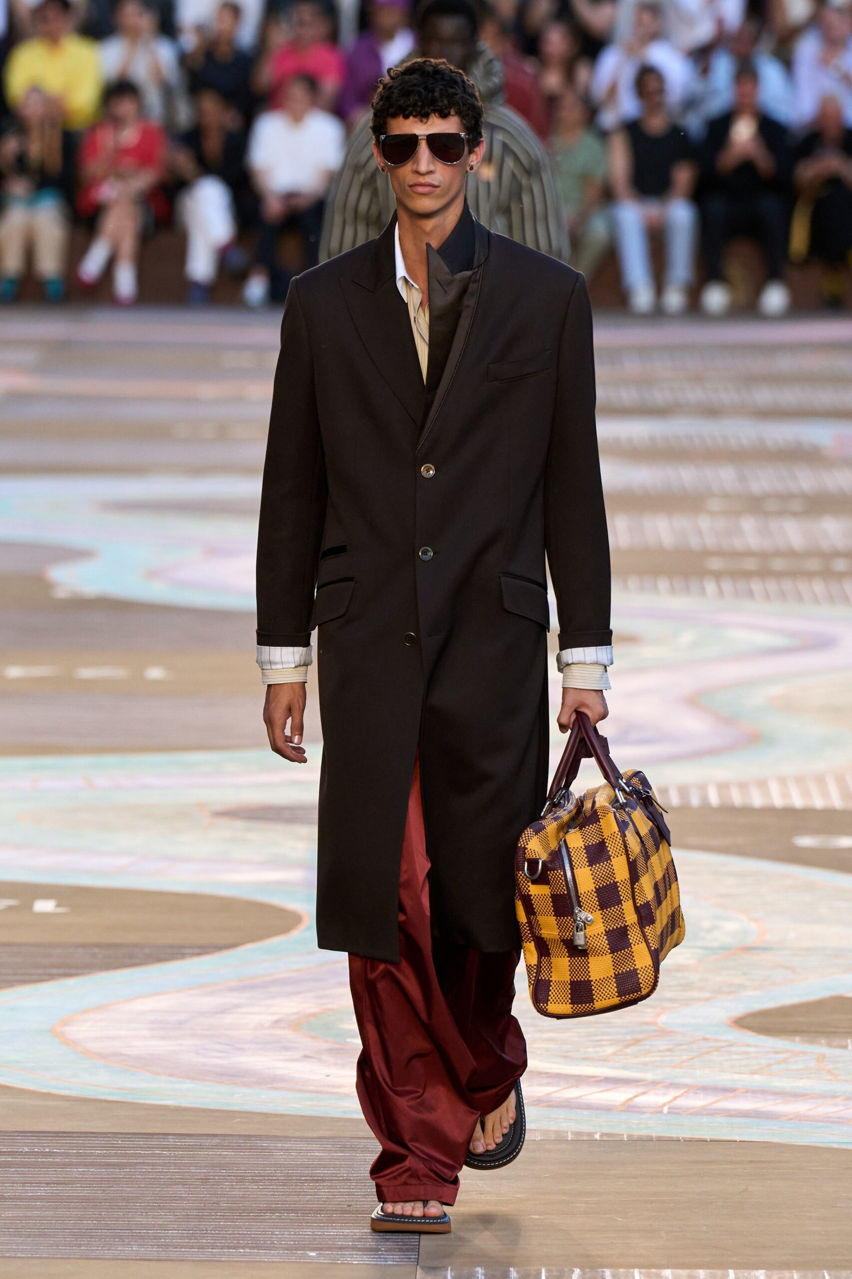 black long-sleeve collared tailored buttoned coat