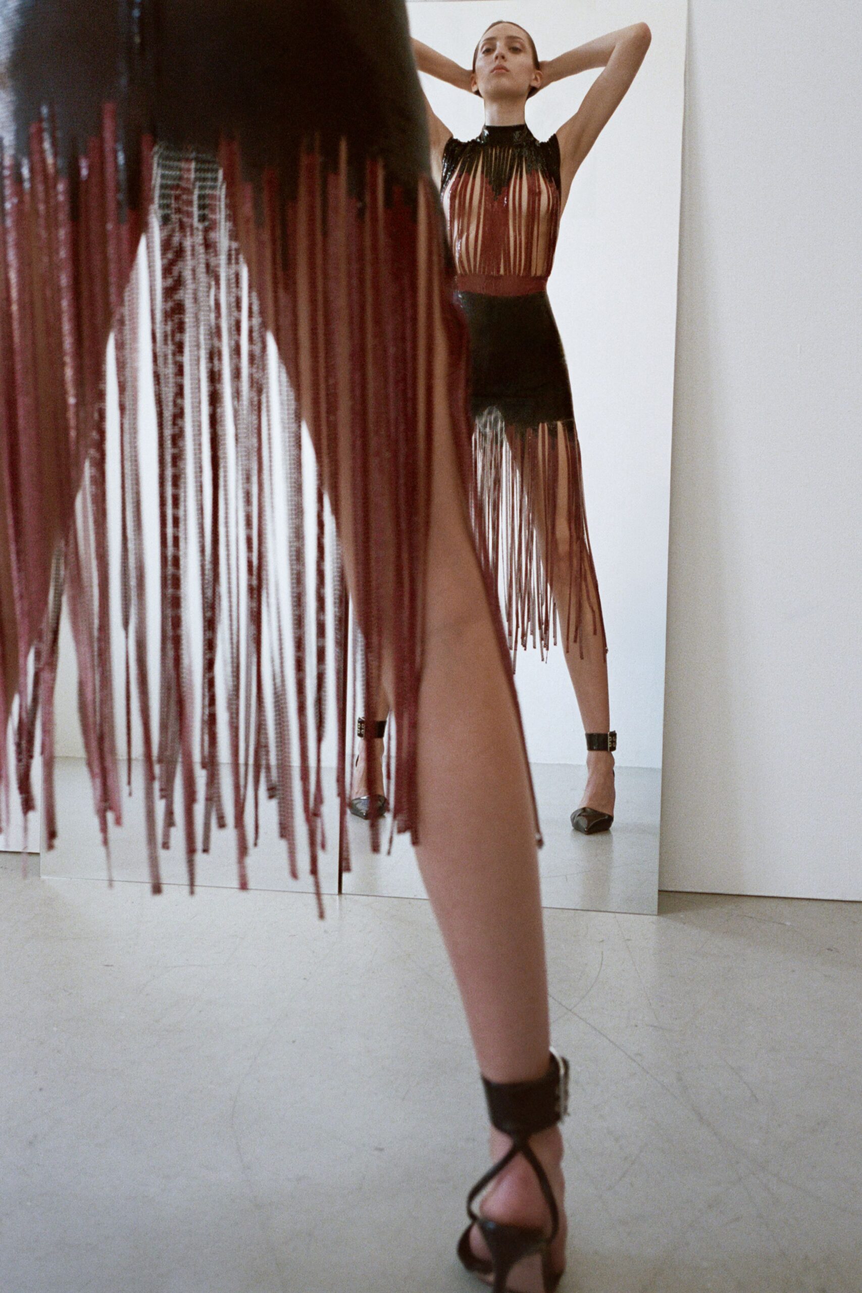 black leather fringed mini dress