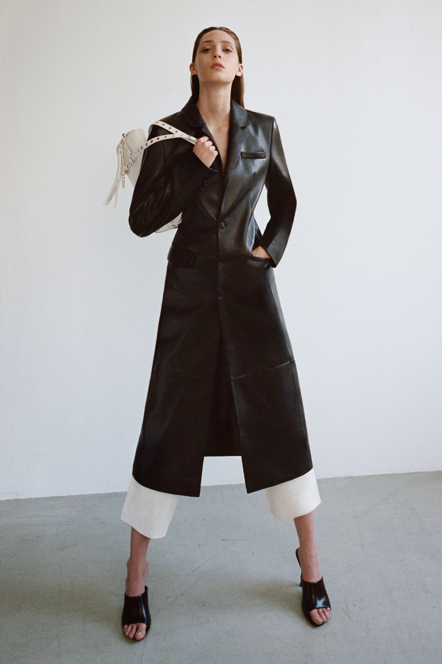 black leather long-sleeve collared fitted buttoned coat