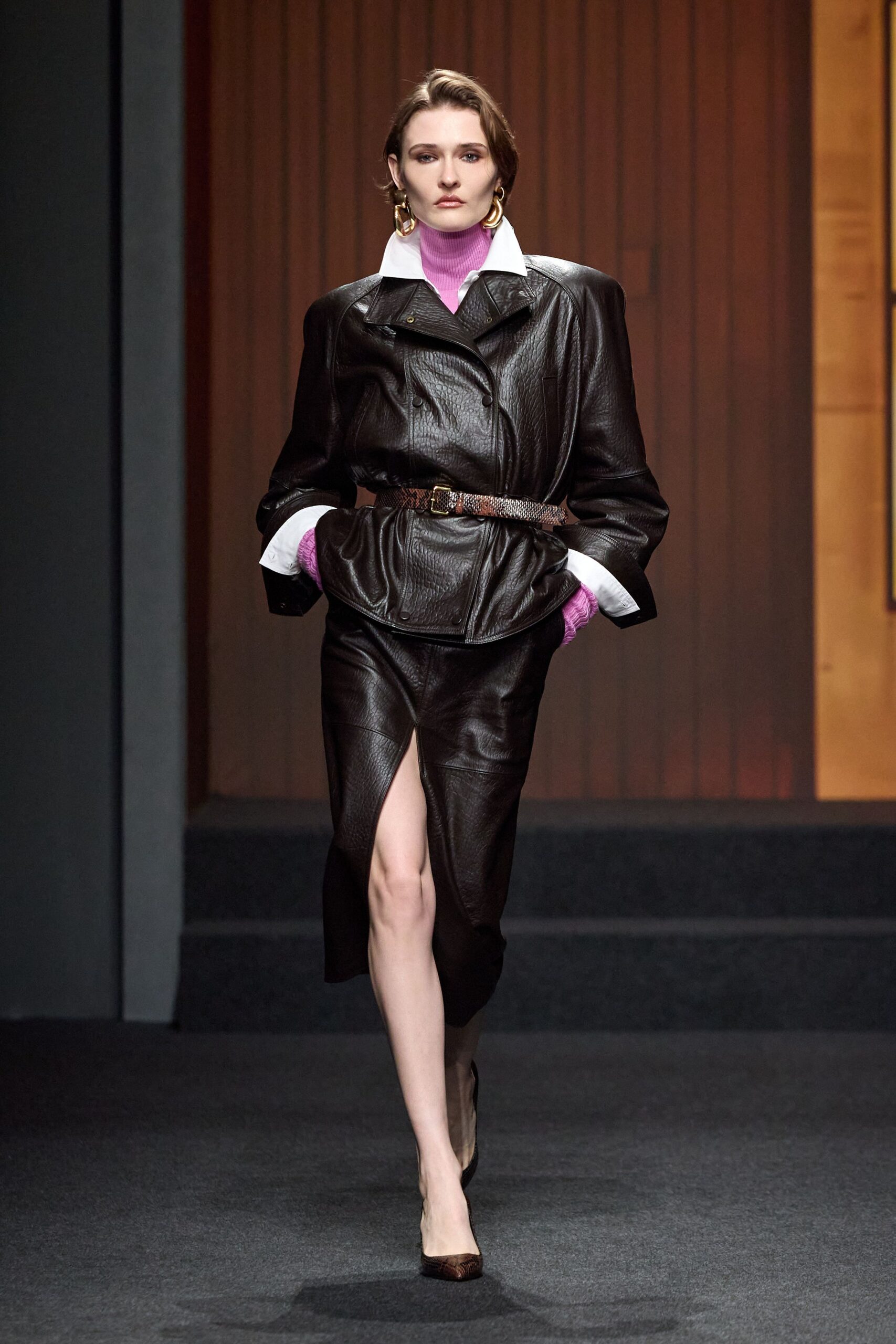 black leather long-sleeve collared fitted zippered belted jacket