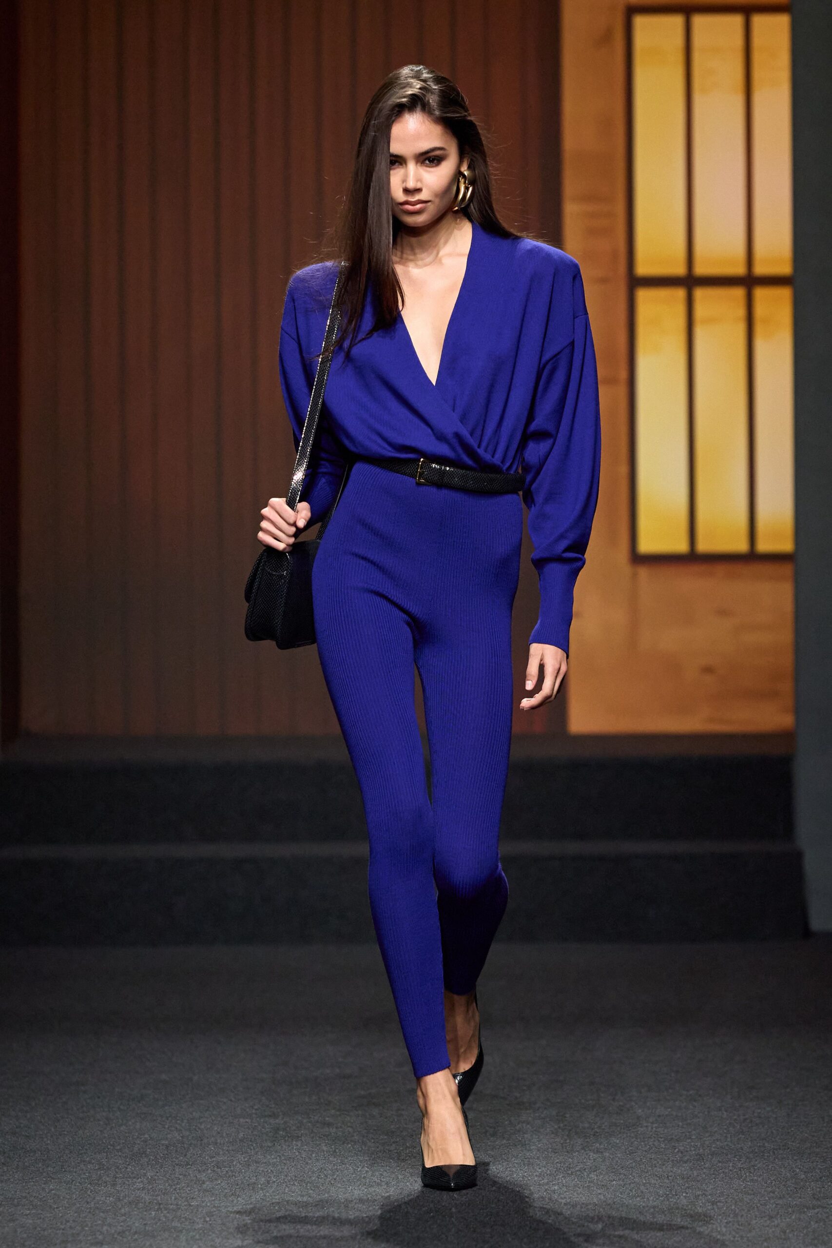 blue fitted catsuit with accessories