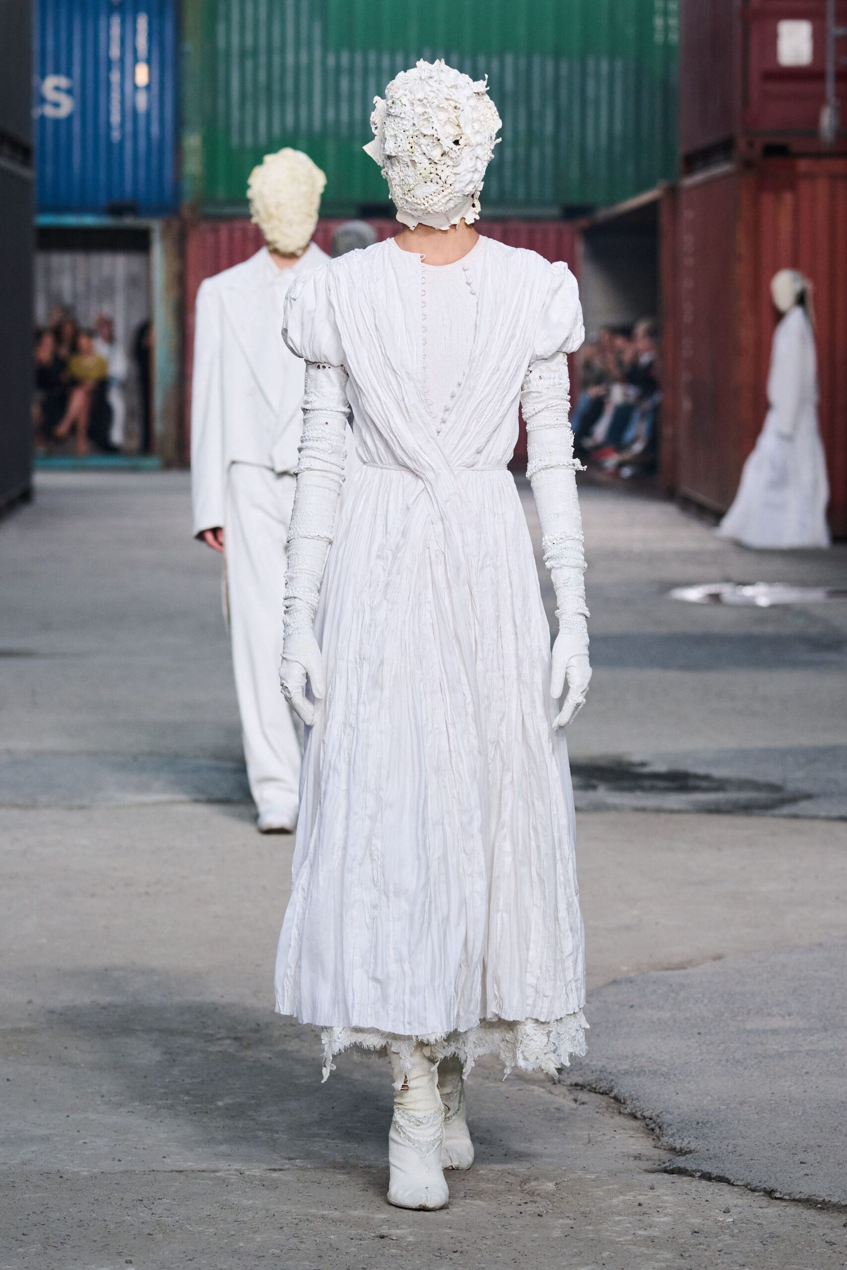 white cotton long-sleeve v-neck fitted pleated tiered gown