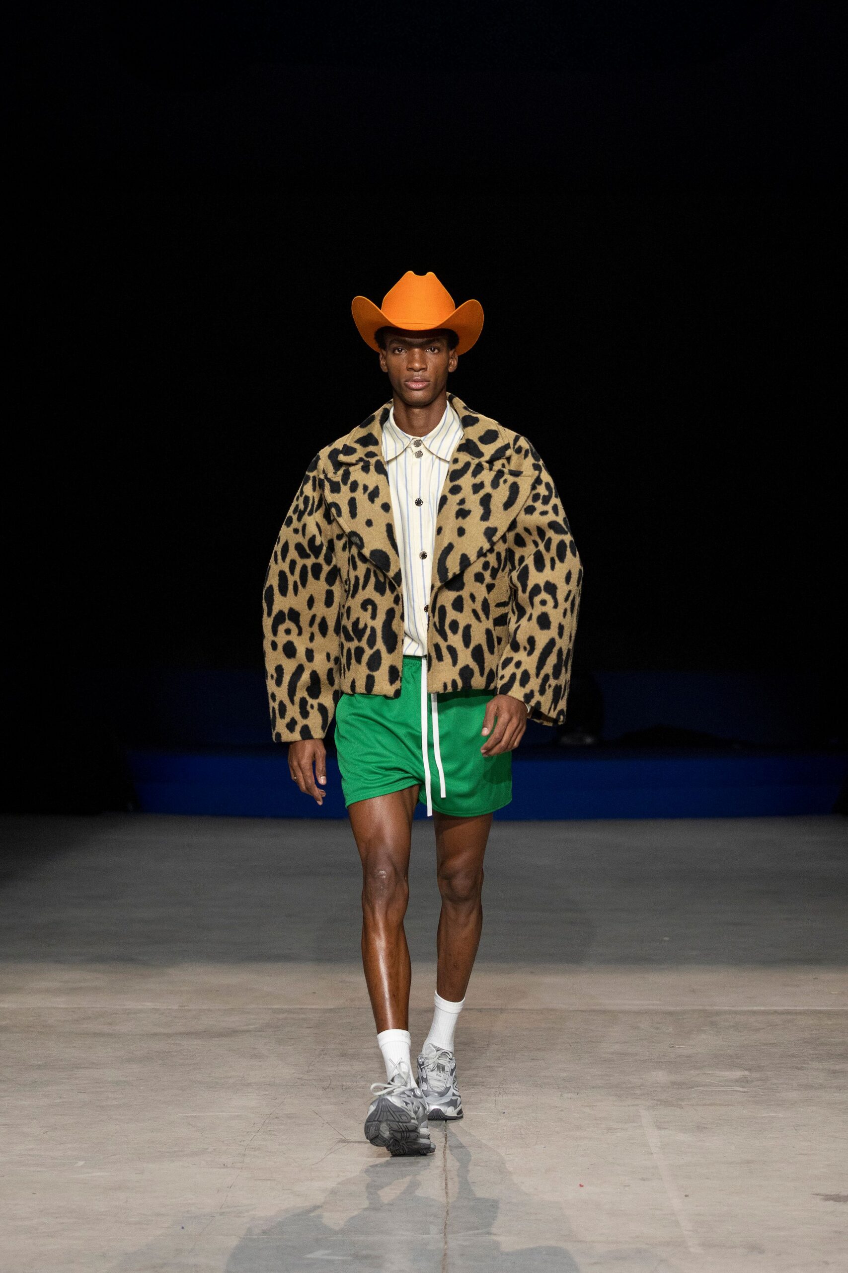 brown animal-print jacket with green shorts
