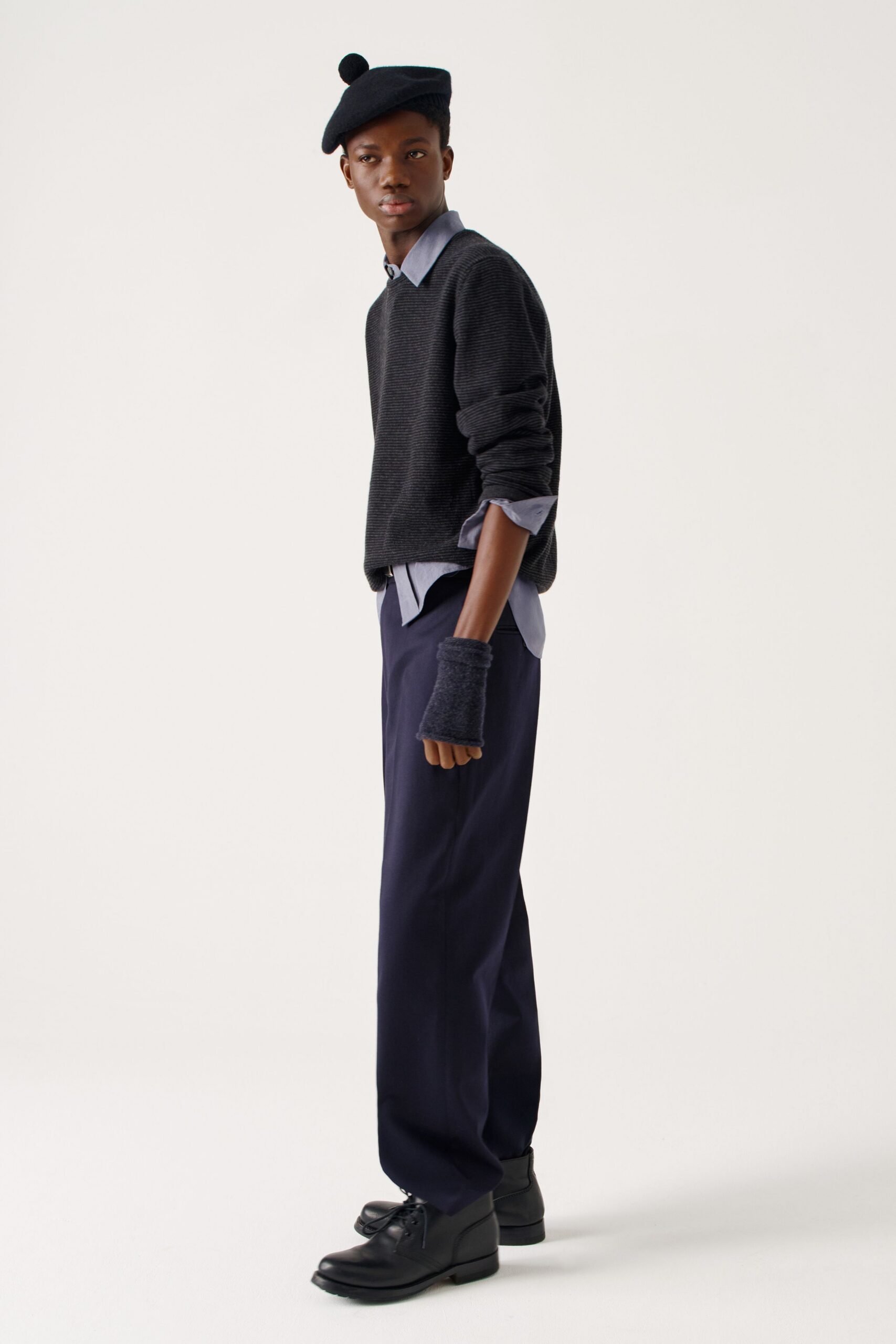 black sweater blue shirt navy pants