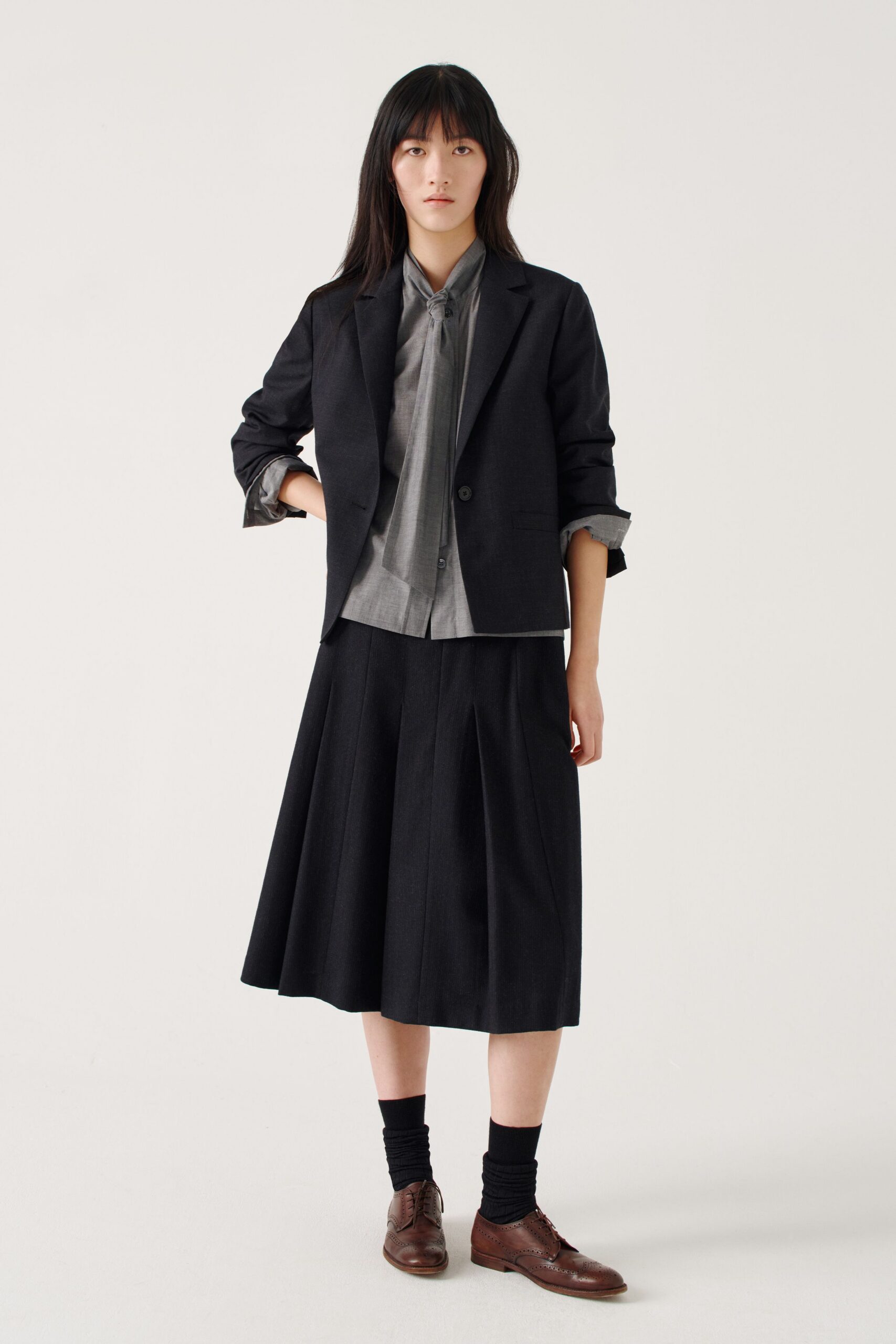 black cotton long-sleeve collared structured buttoned blazer