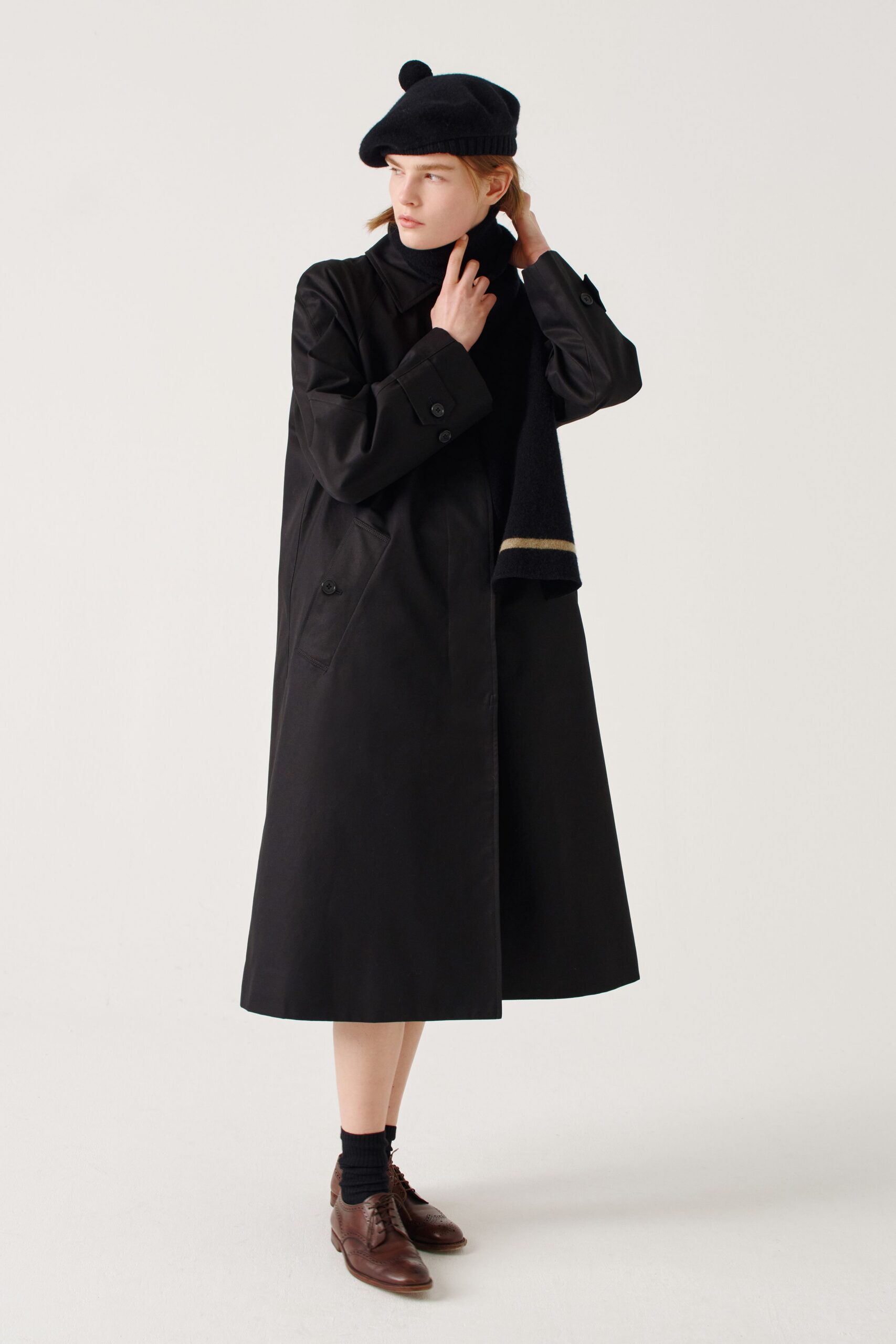 black cotton long-sleeve collared relaxed buttoned midi coat