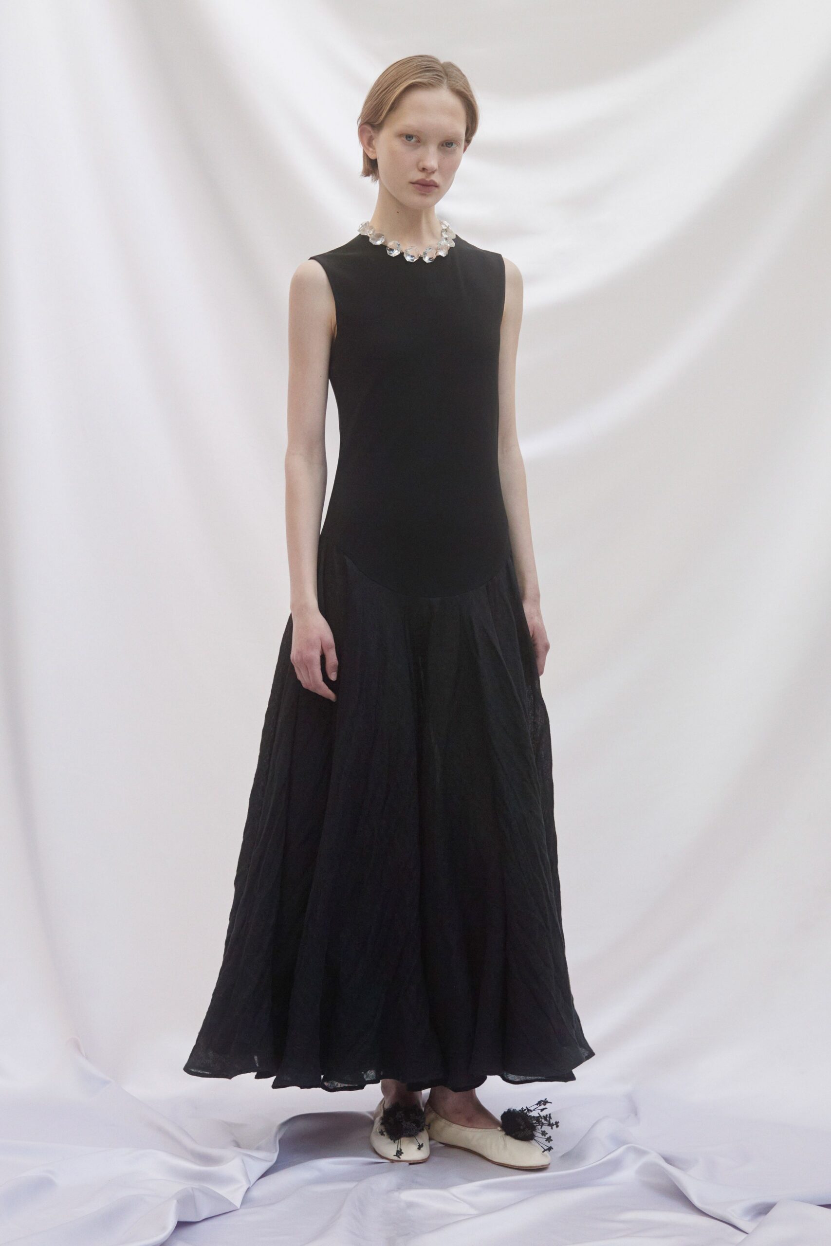 black silk sleeveless high-neck fitted draped tiered gown