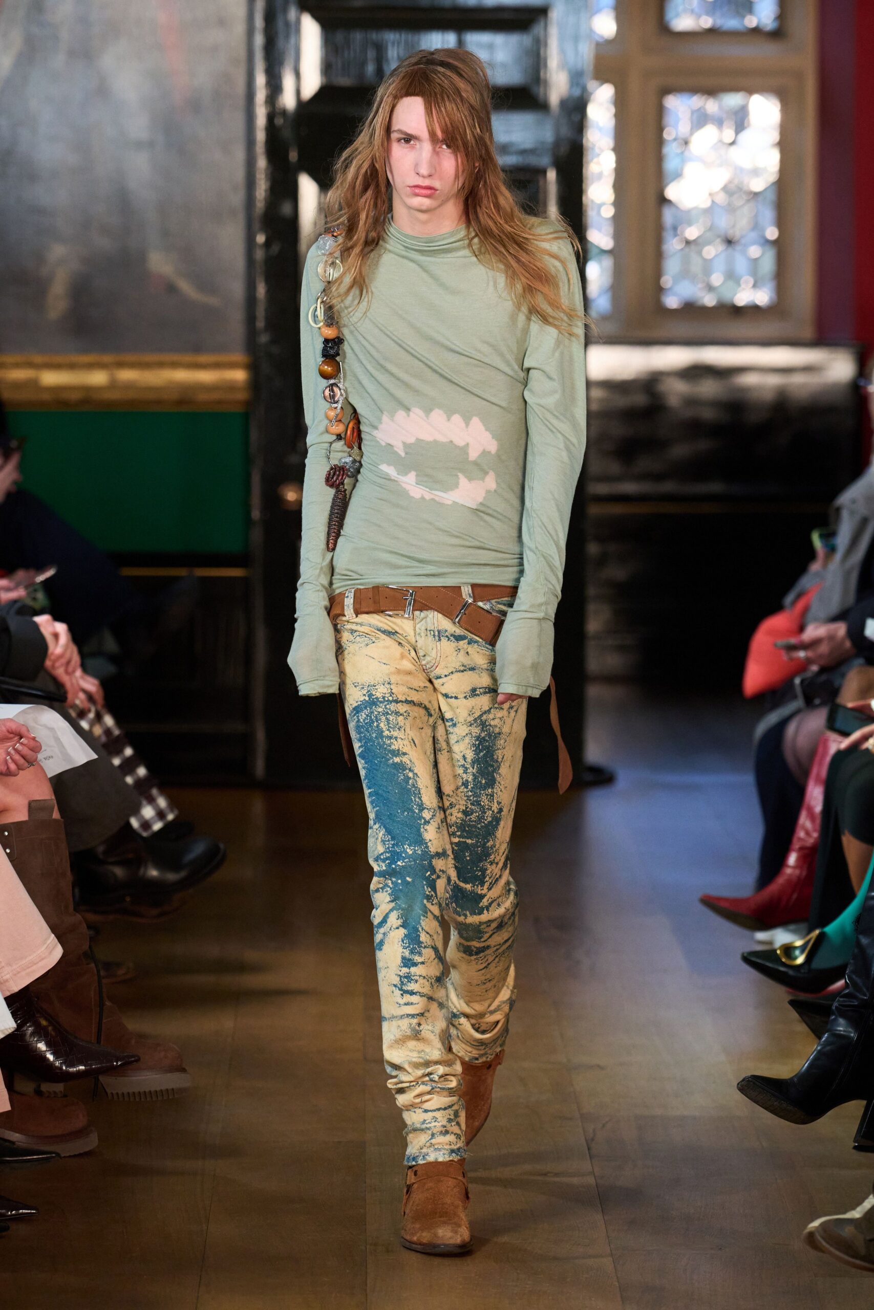 green fitted top with distressed pants