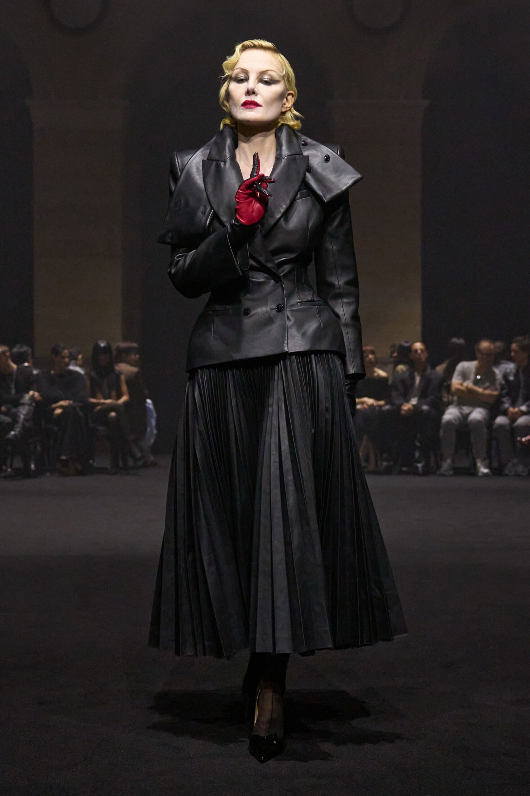 black leather blazer and pleated skirt