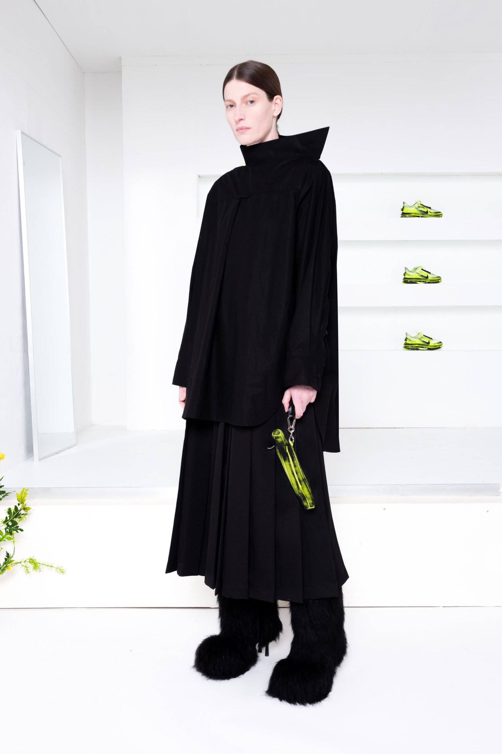 black relaxed top with pleated skirt