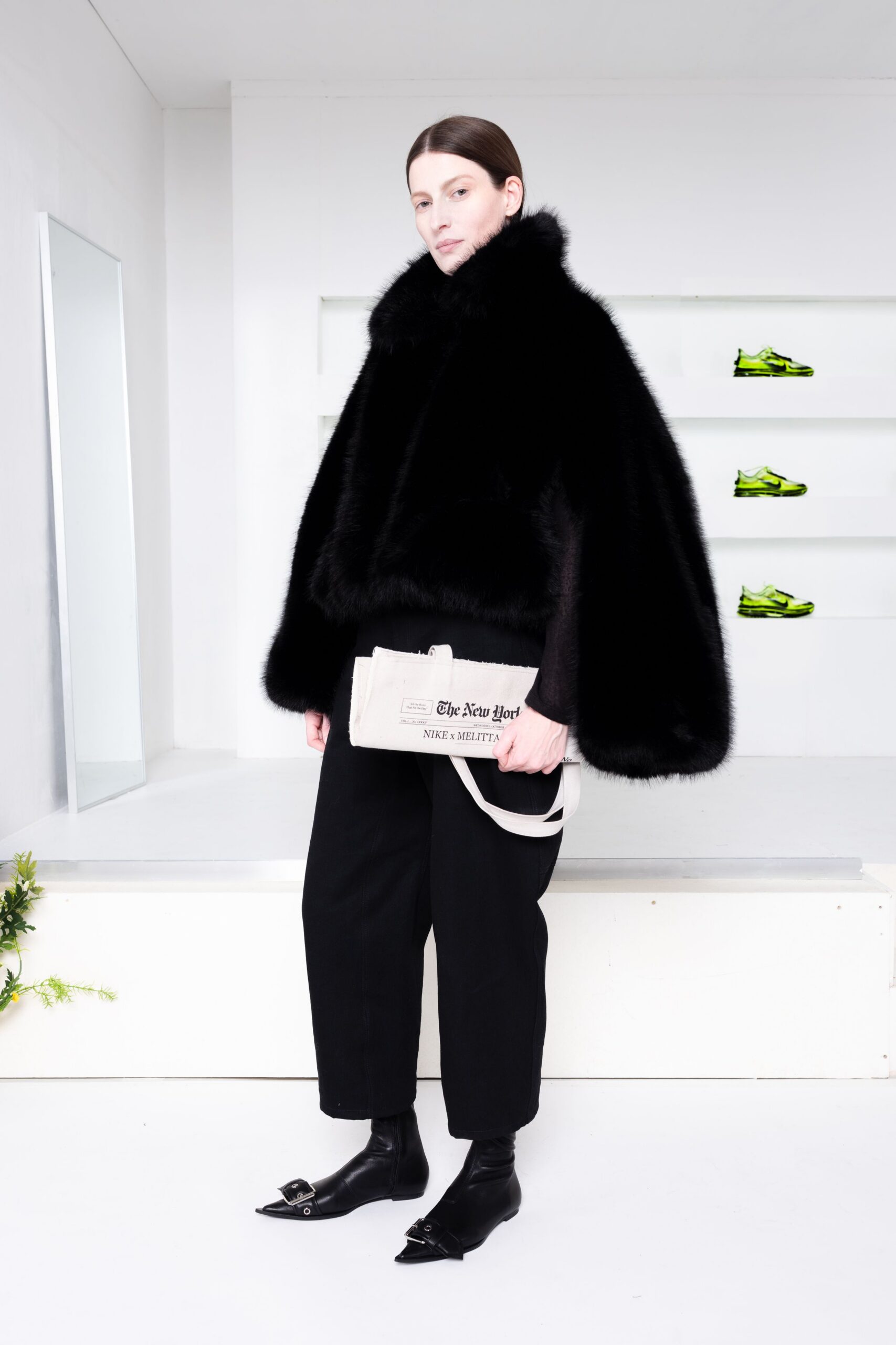black fur cape with relaxed pants