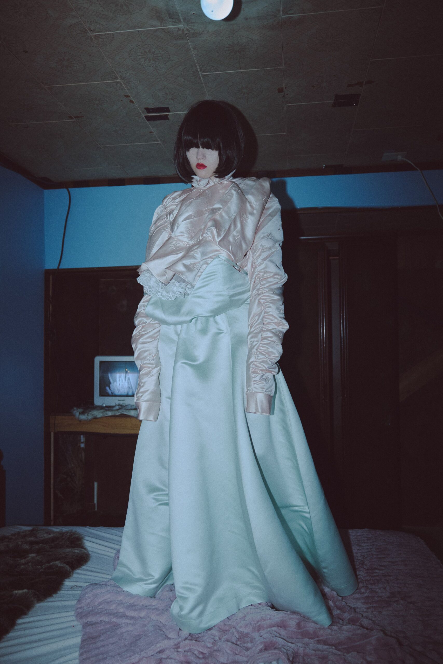 green satin long-sleeve high-neck fitted ruffled maxi gown