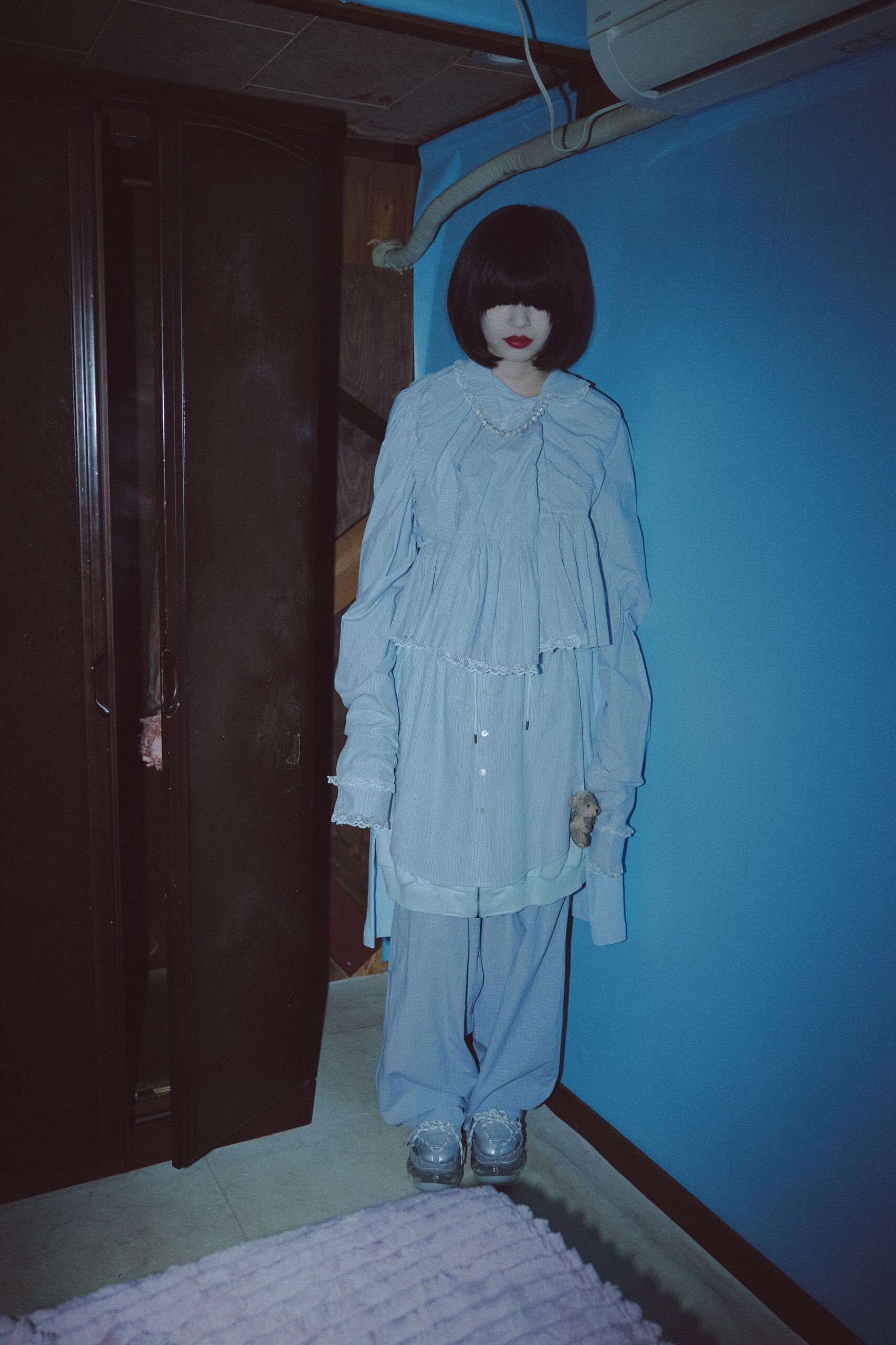 blue cotton long-sleeve collared oversized ruffled top
