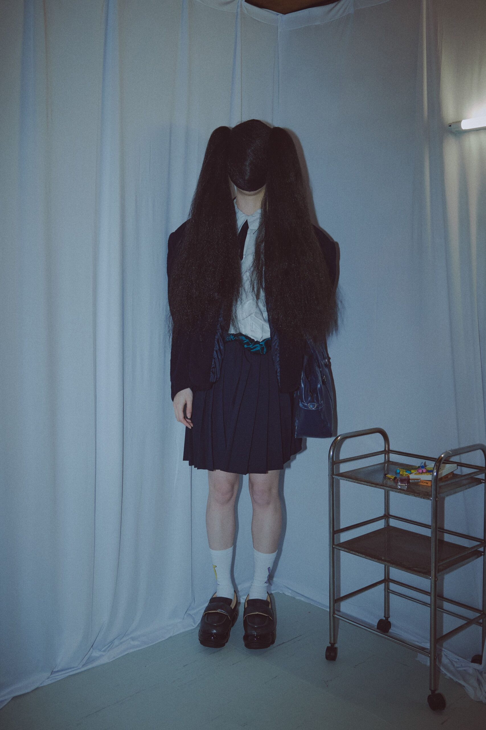 black blazer white shirt pleated skirt