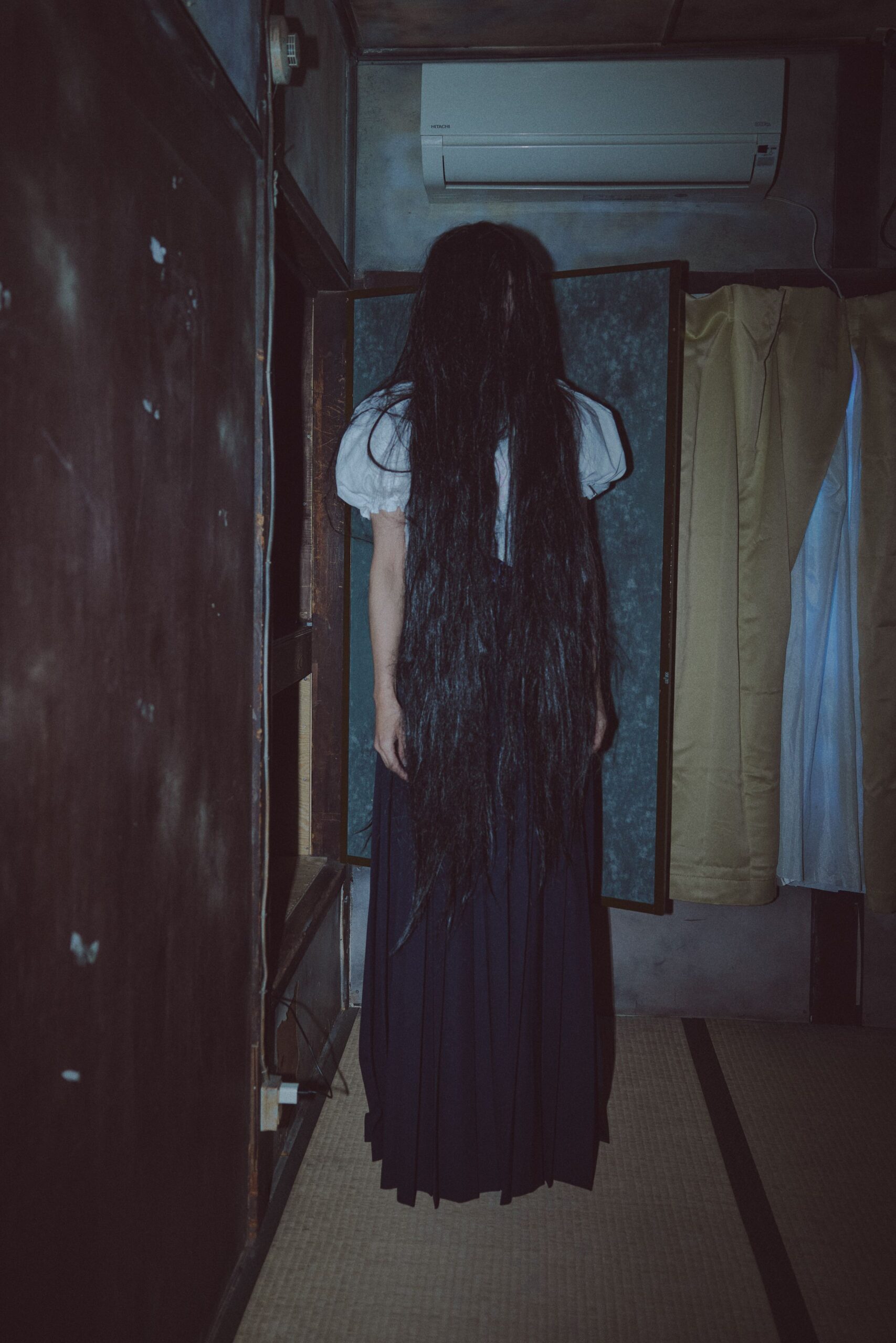 black pleated long-sleeve dress