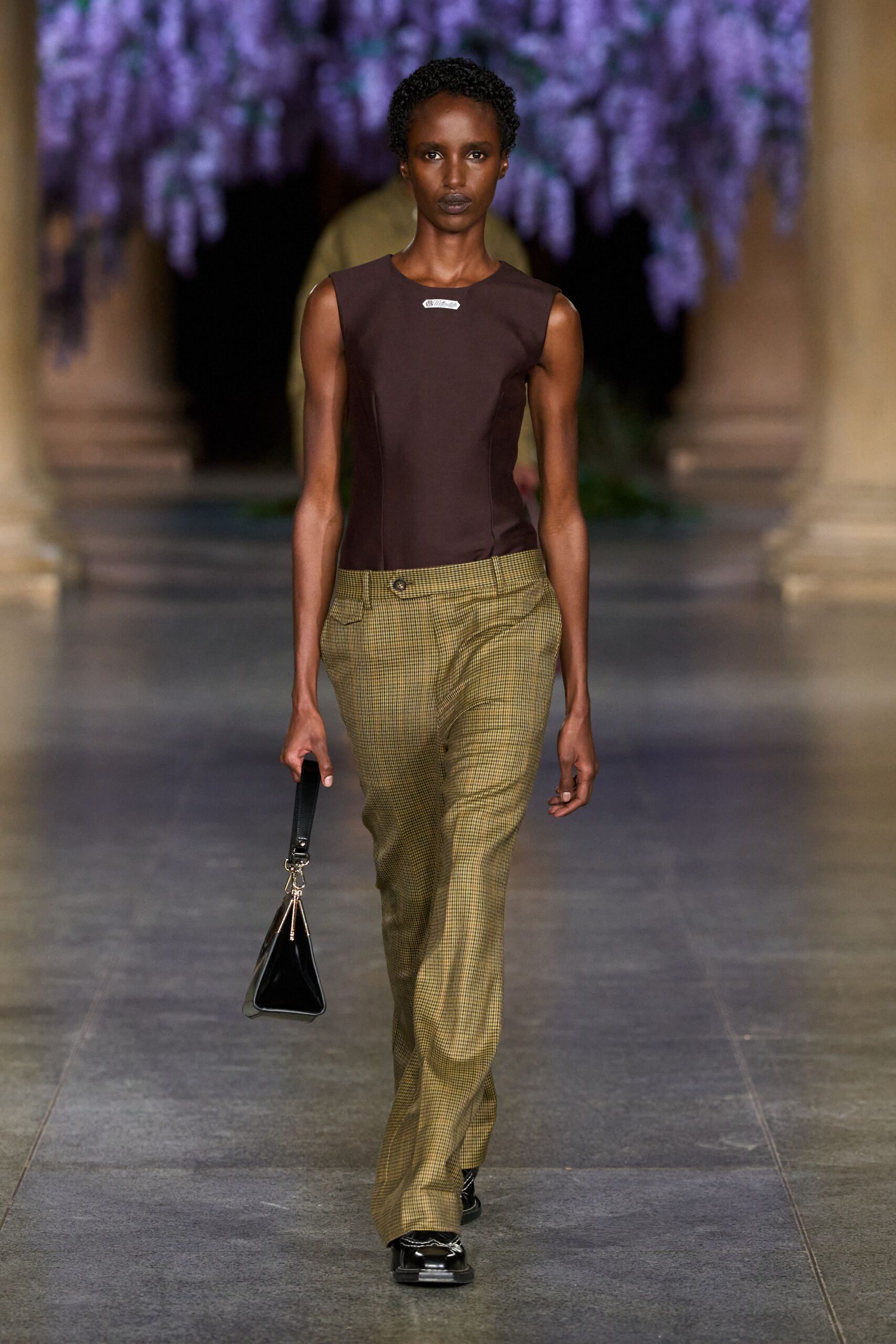 brown fitted sleeveless top with green pants