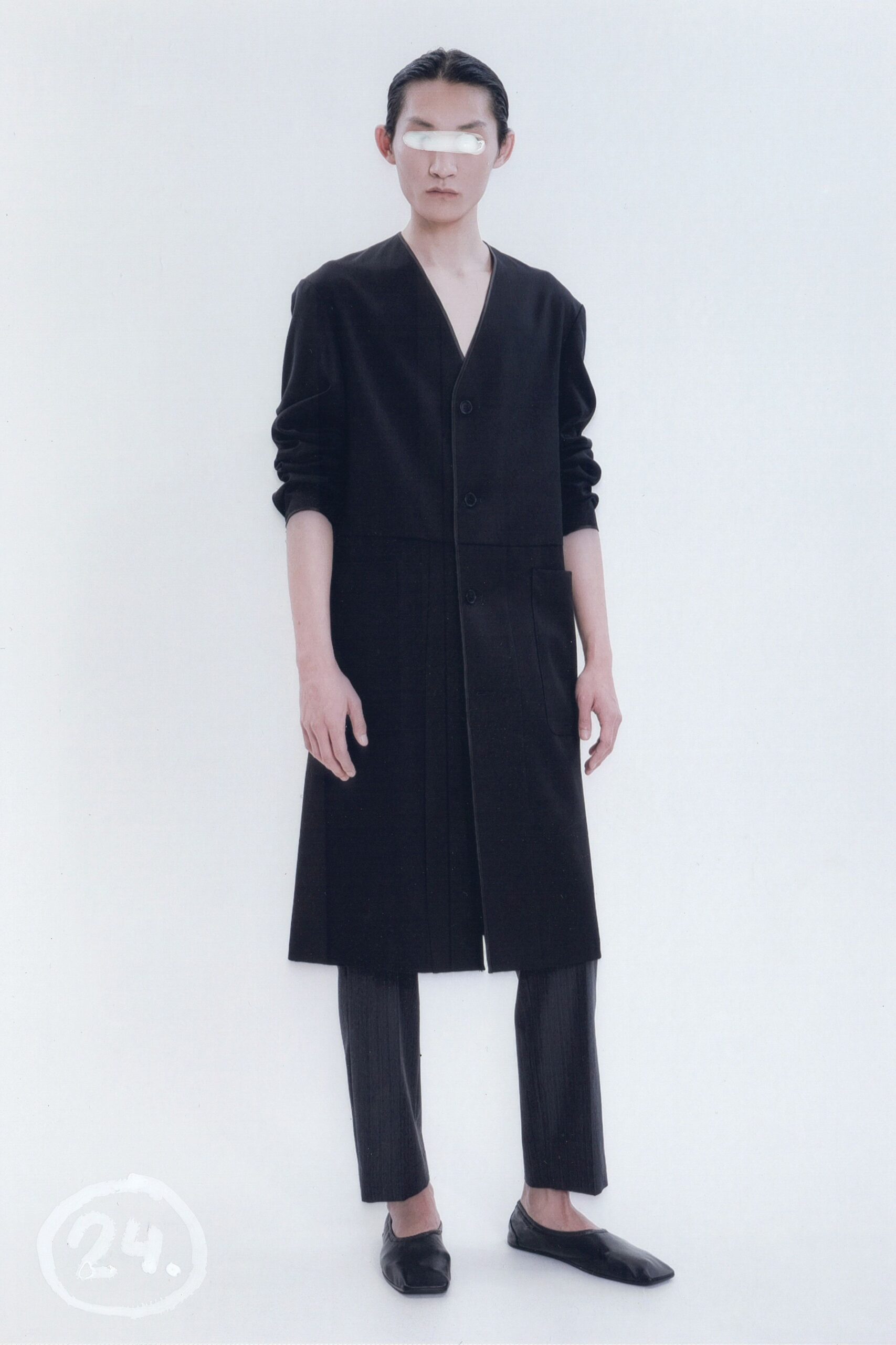 black cotton long-sleeve collared relaxed buttoned pleated coat