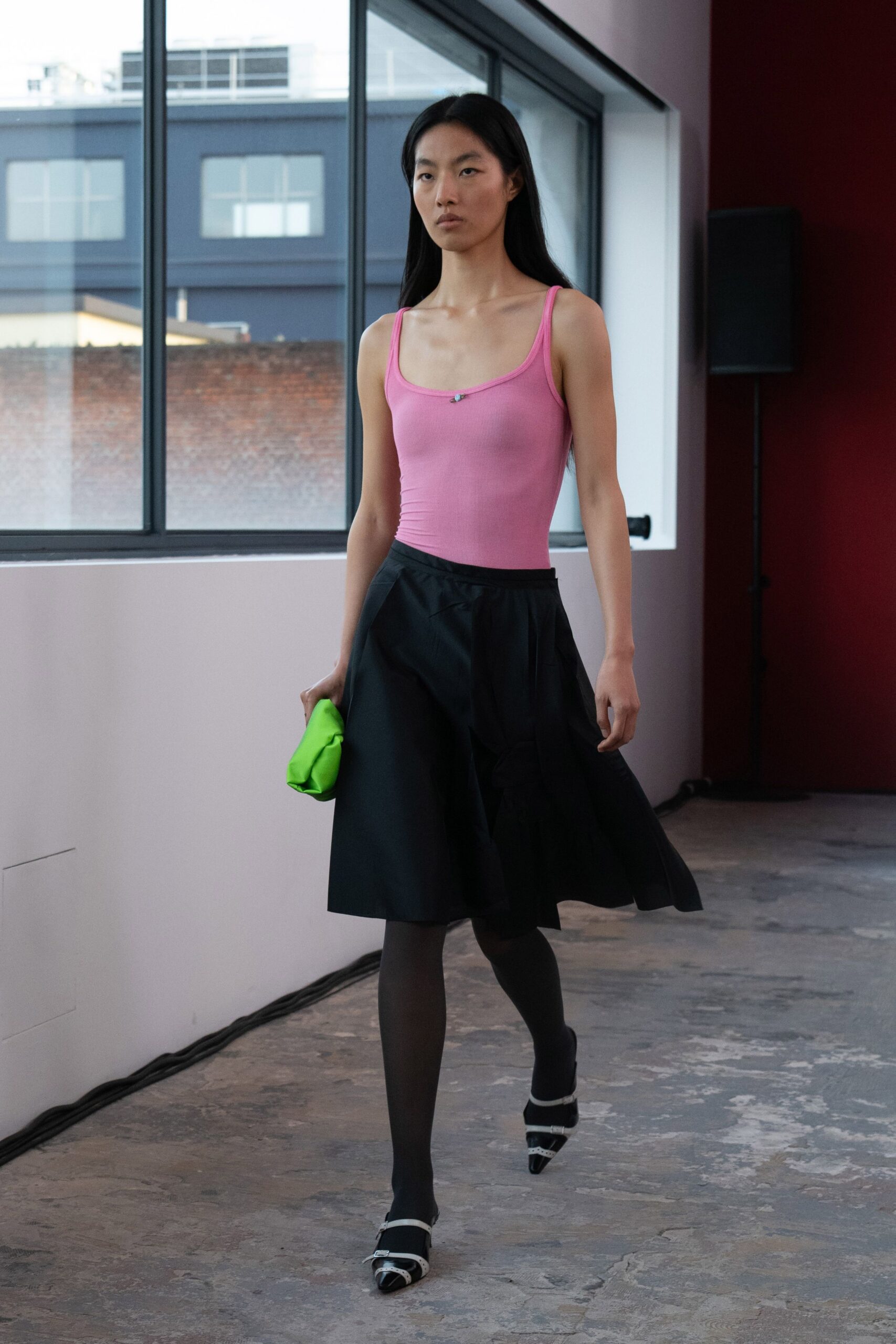 pink fitted top black skirt
