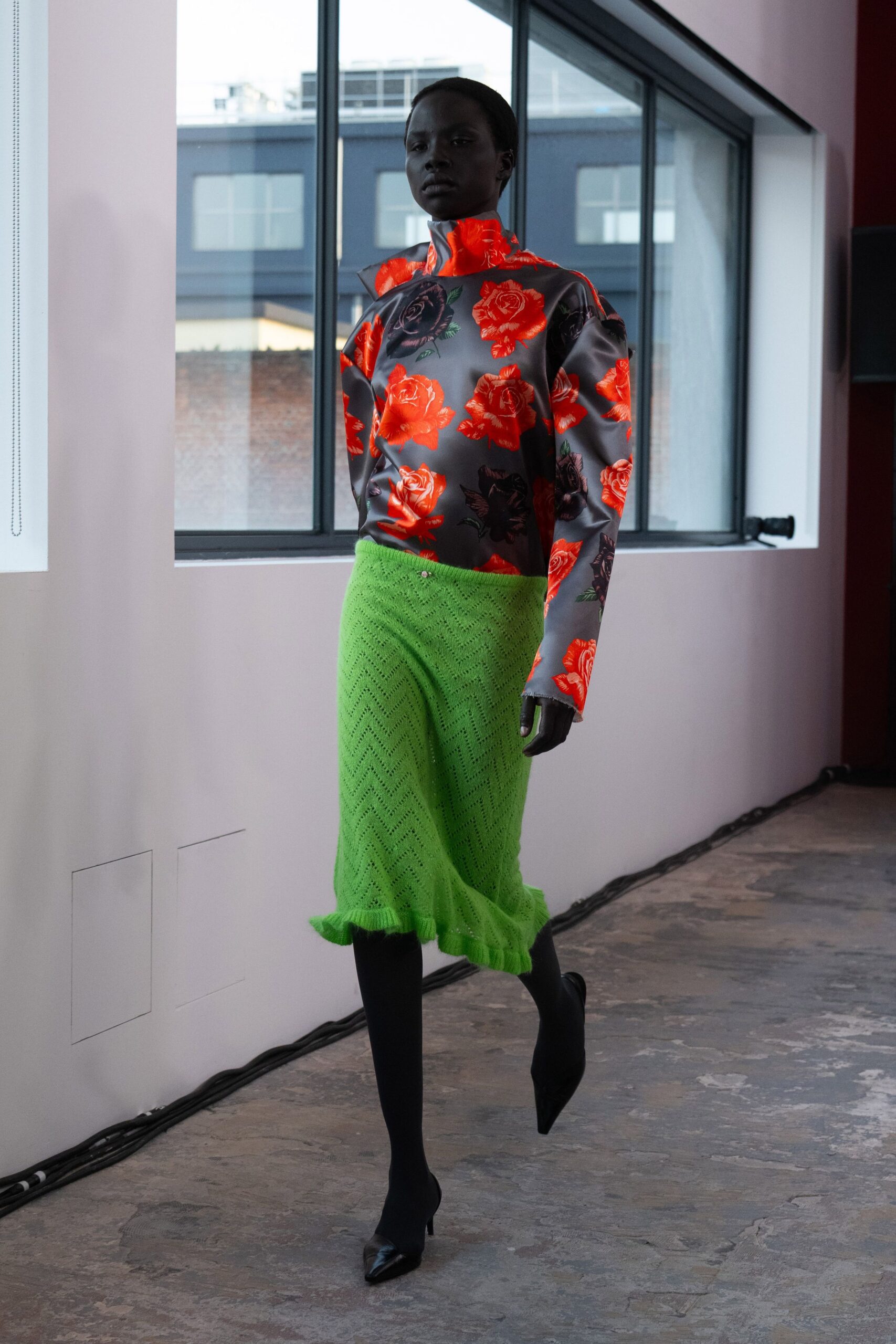 gray floral top with green skirt