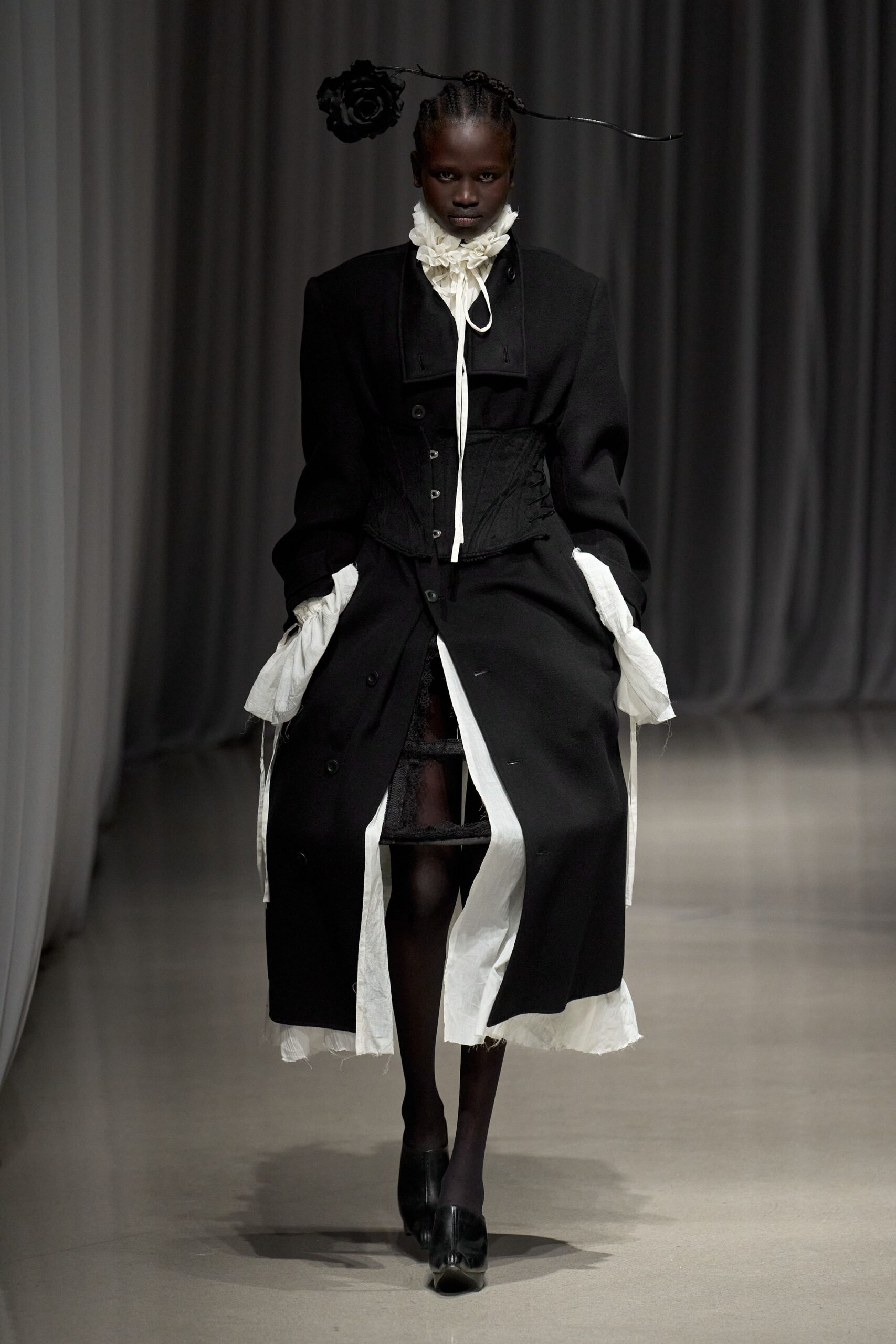 black wool coat with white blouse