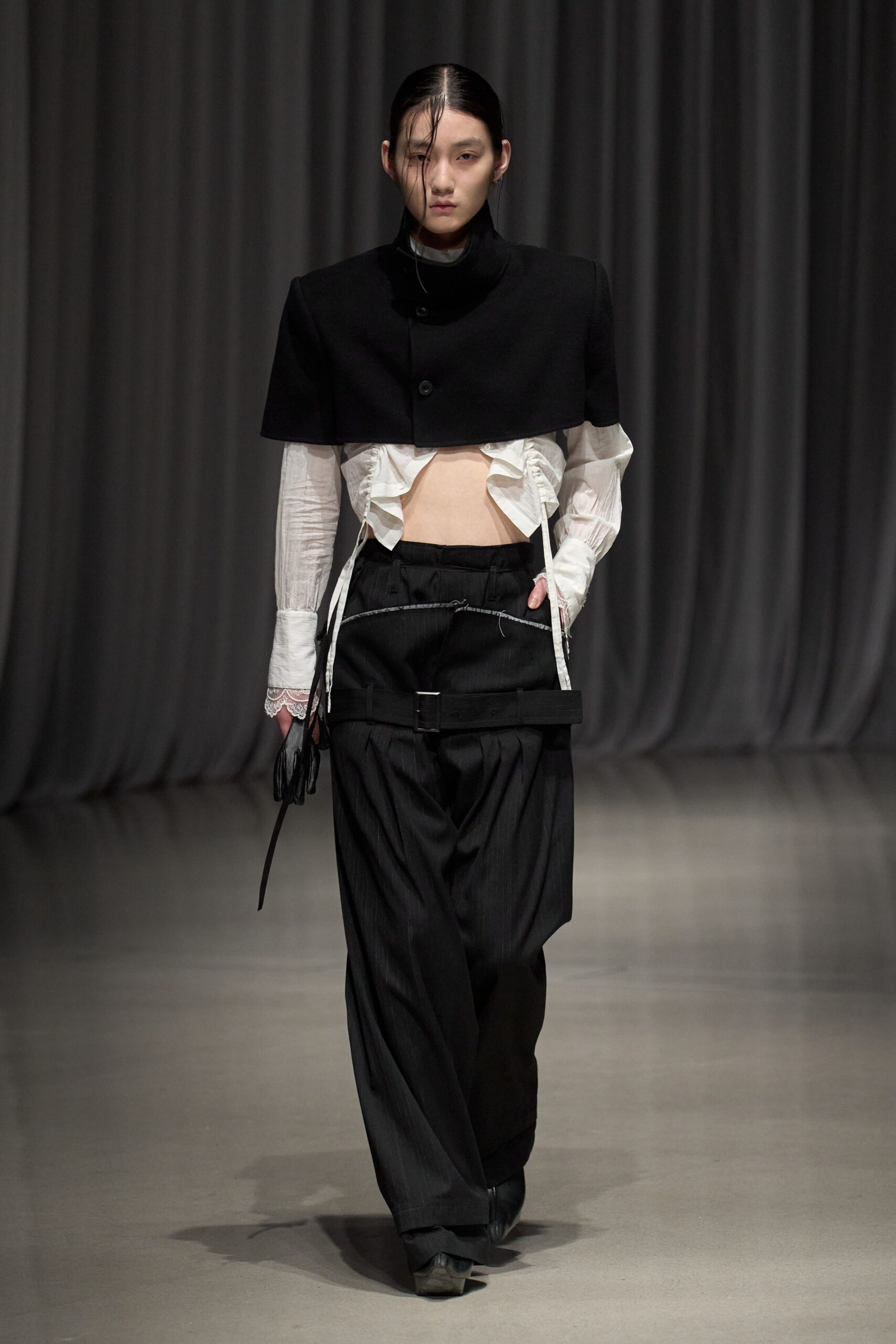 black structured jacket with white blouse