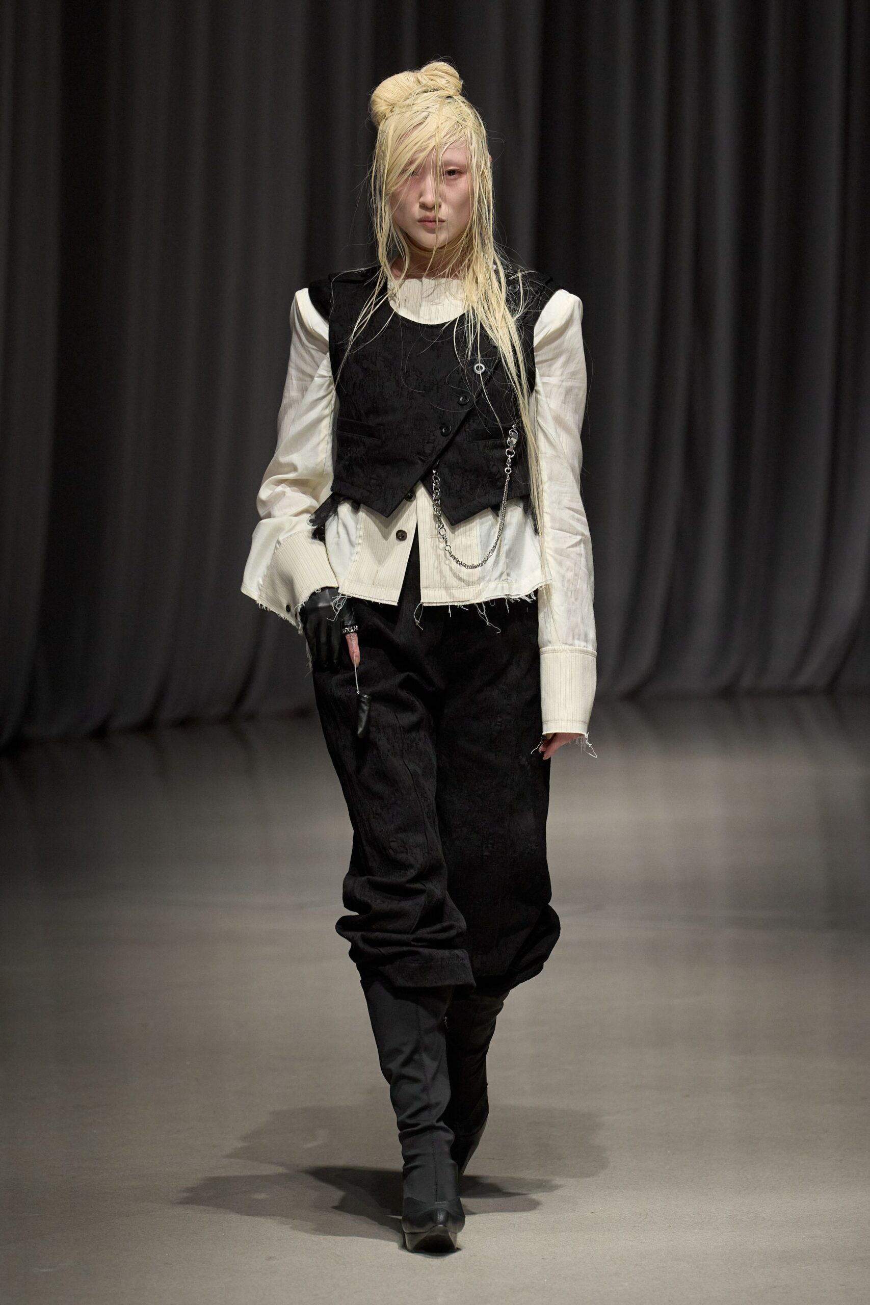 black relaxed vest with white shirt