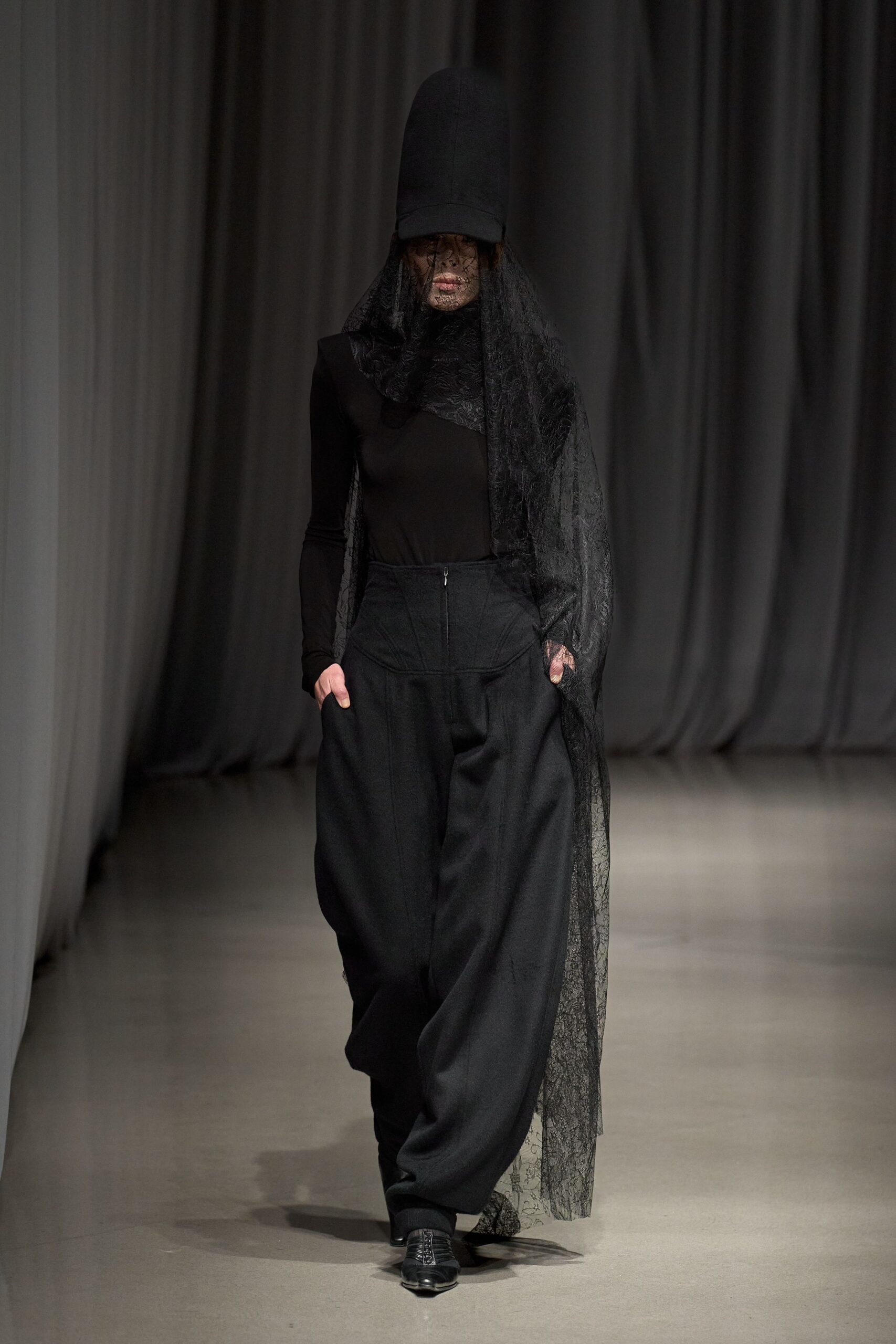 black fitted top and relaxed pants