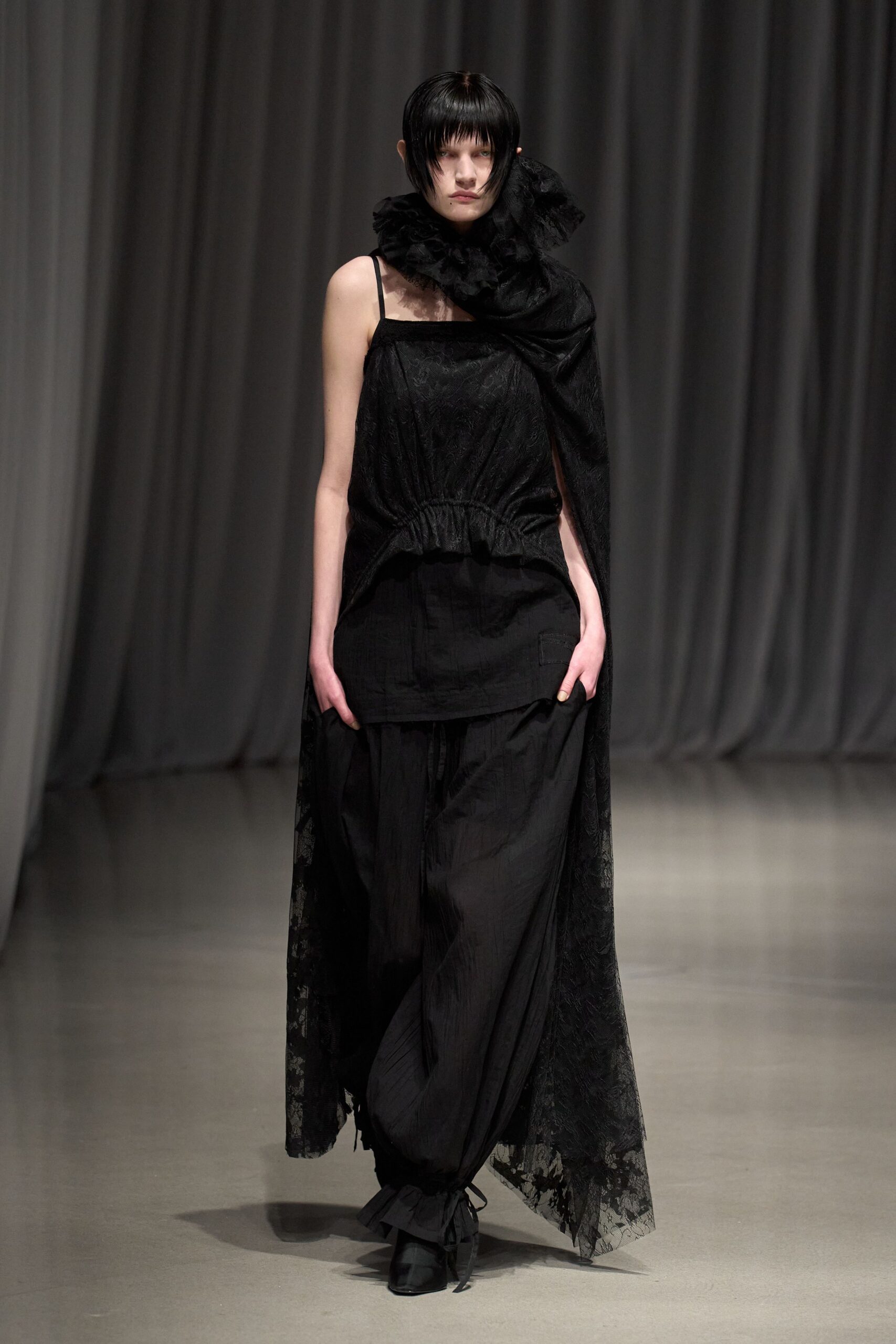 black layered top with wide-leg pants