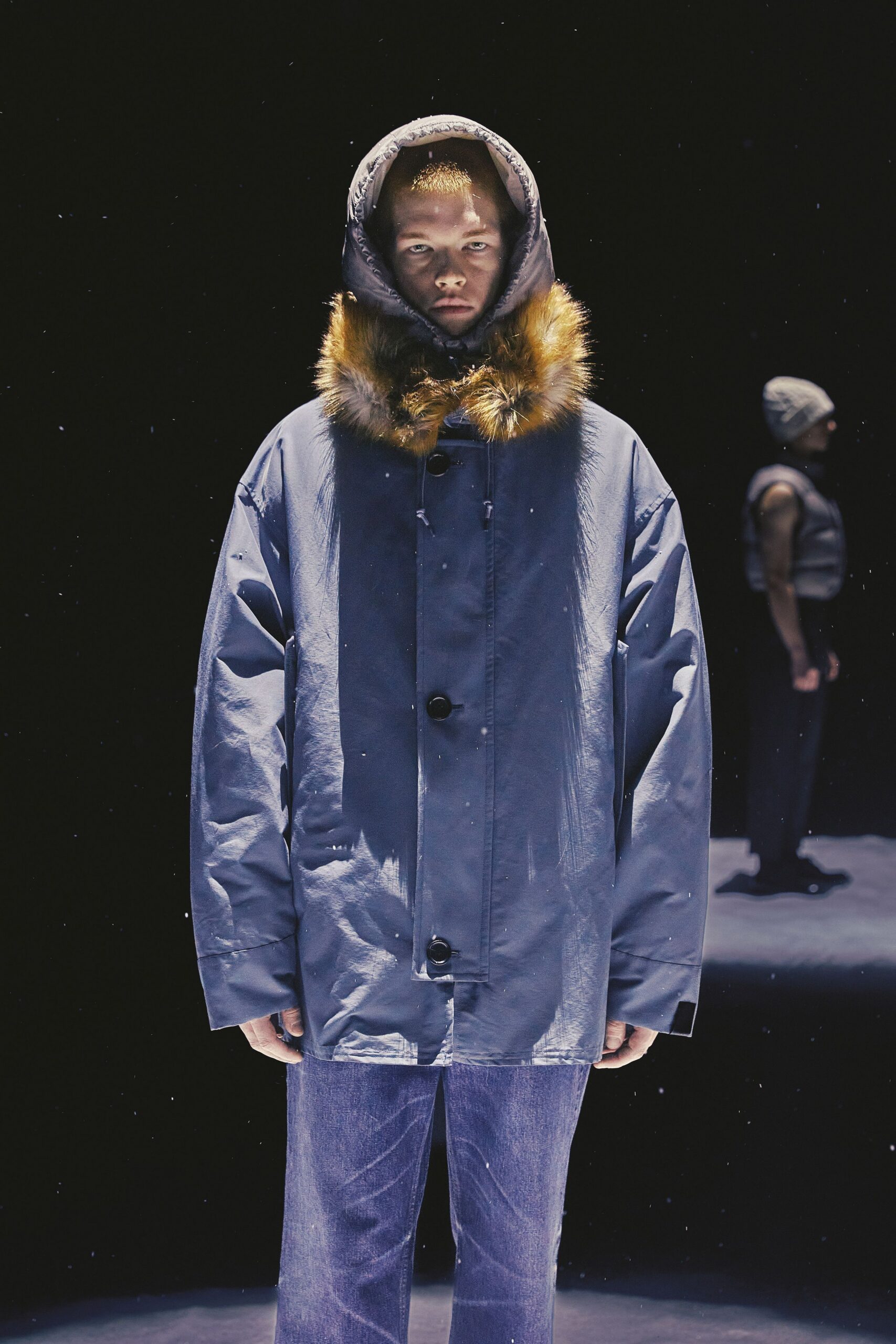 blue vinyl hooded coat with denim pants