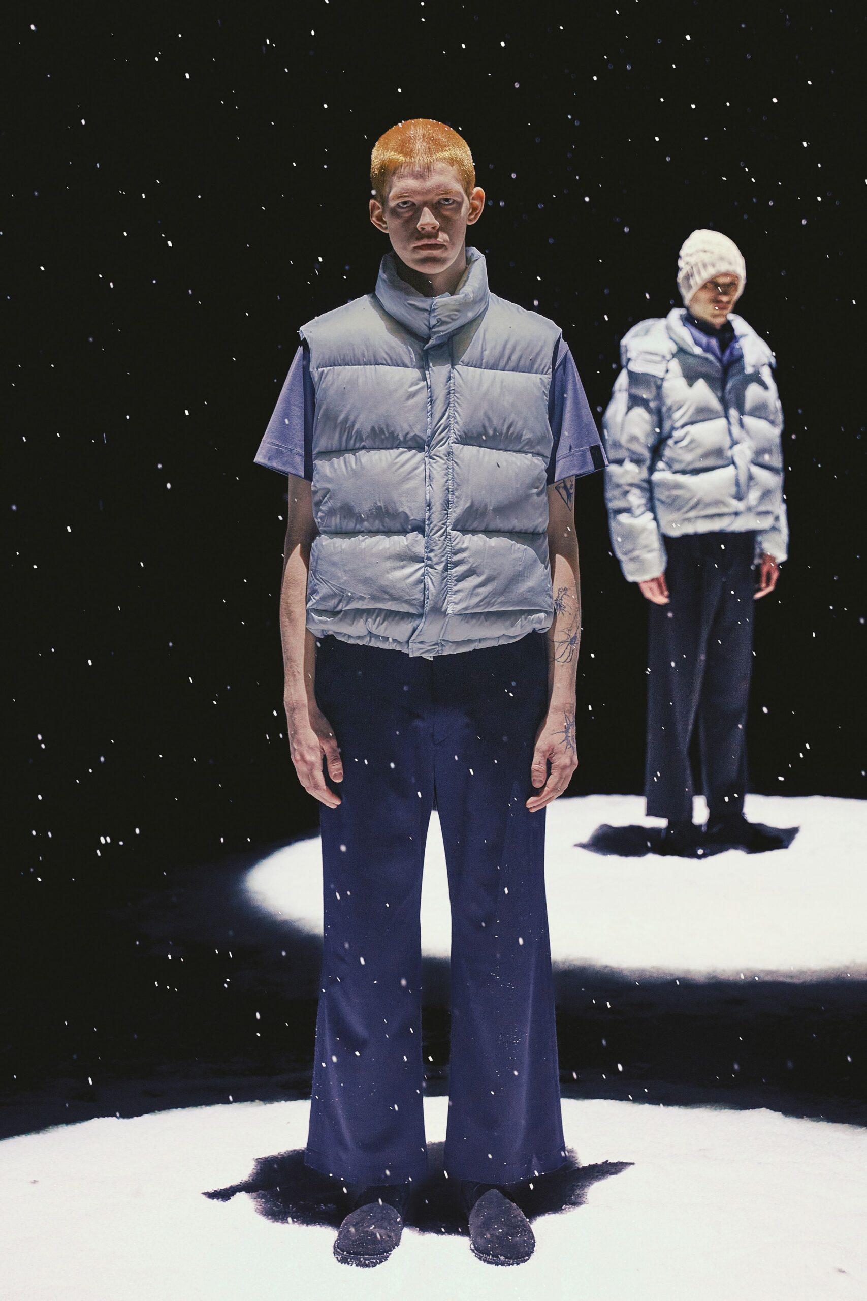 gray padded vest with blue shirt