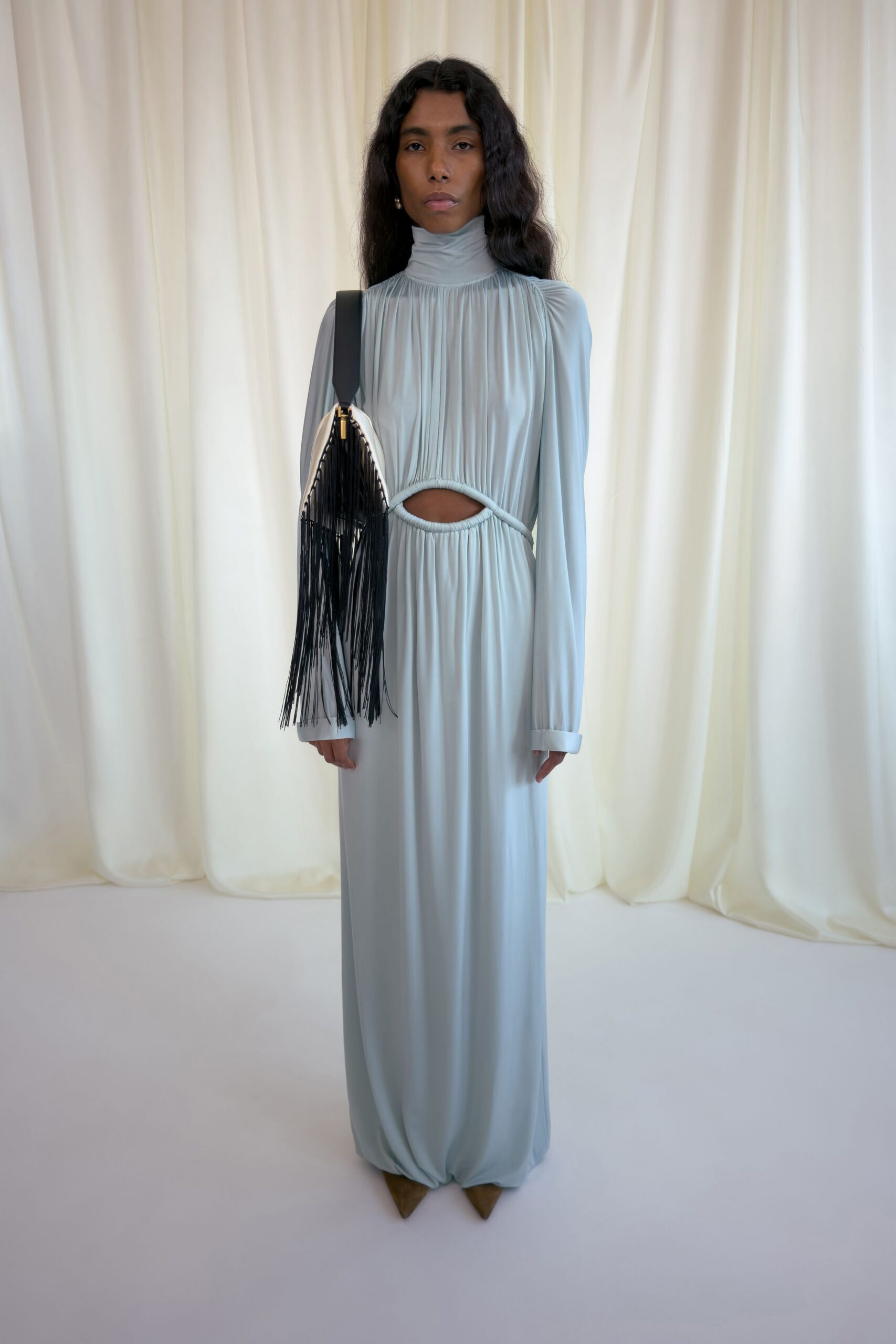 blue silk long-sleeve high-neck fitted pleated flowing gown