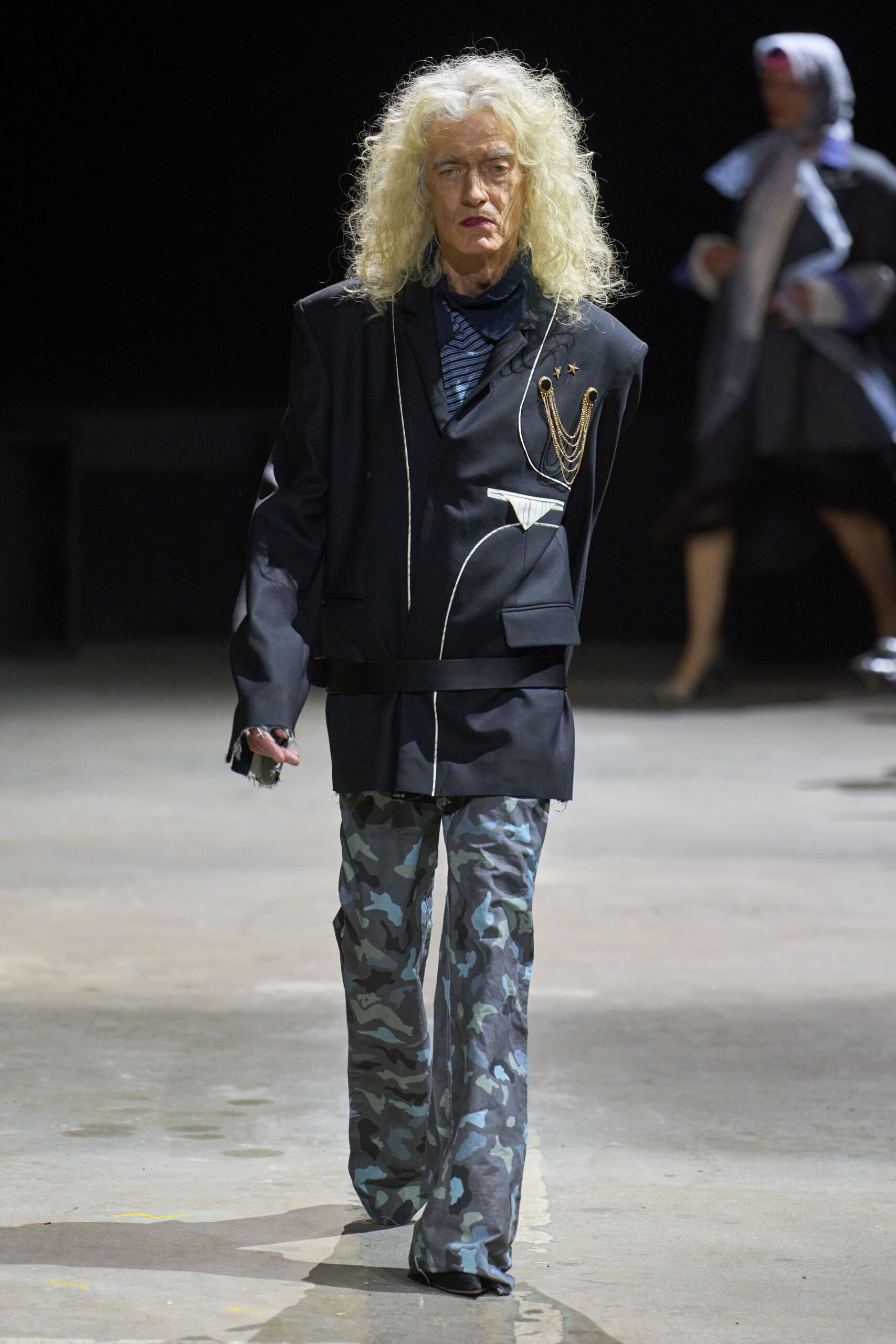 black blazer with camouflage pants