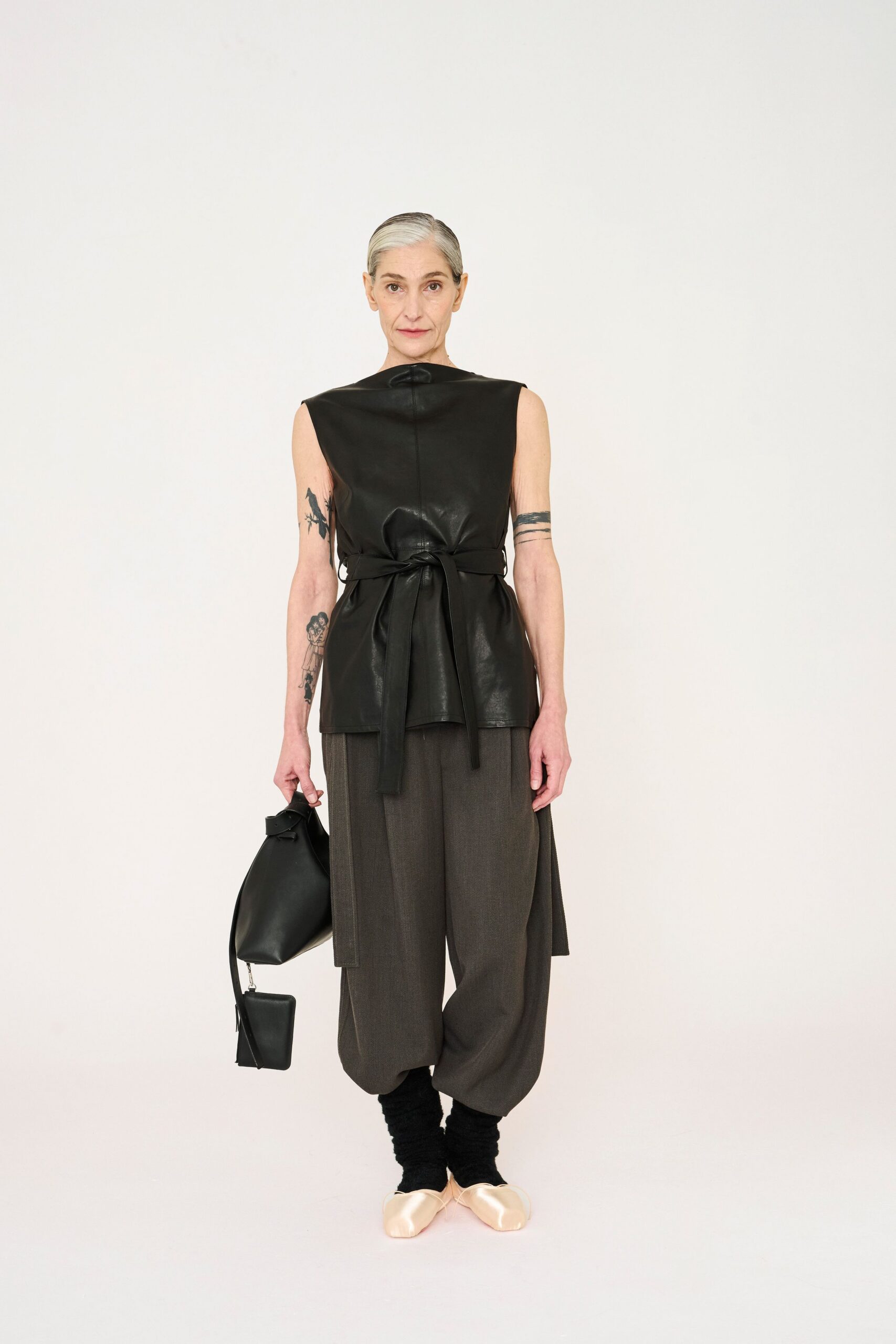 black leather sleeveless high-neck fitted belted top