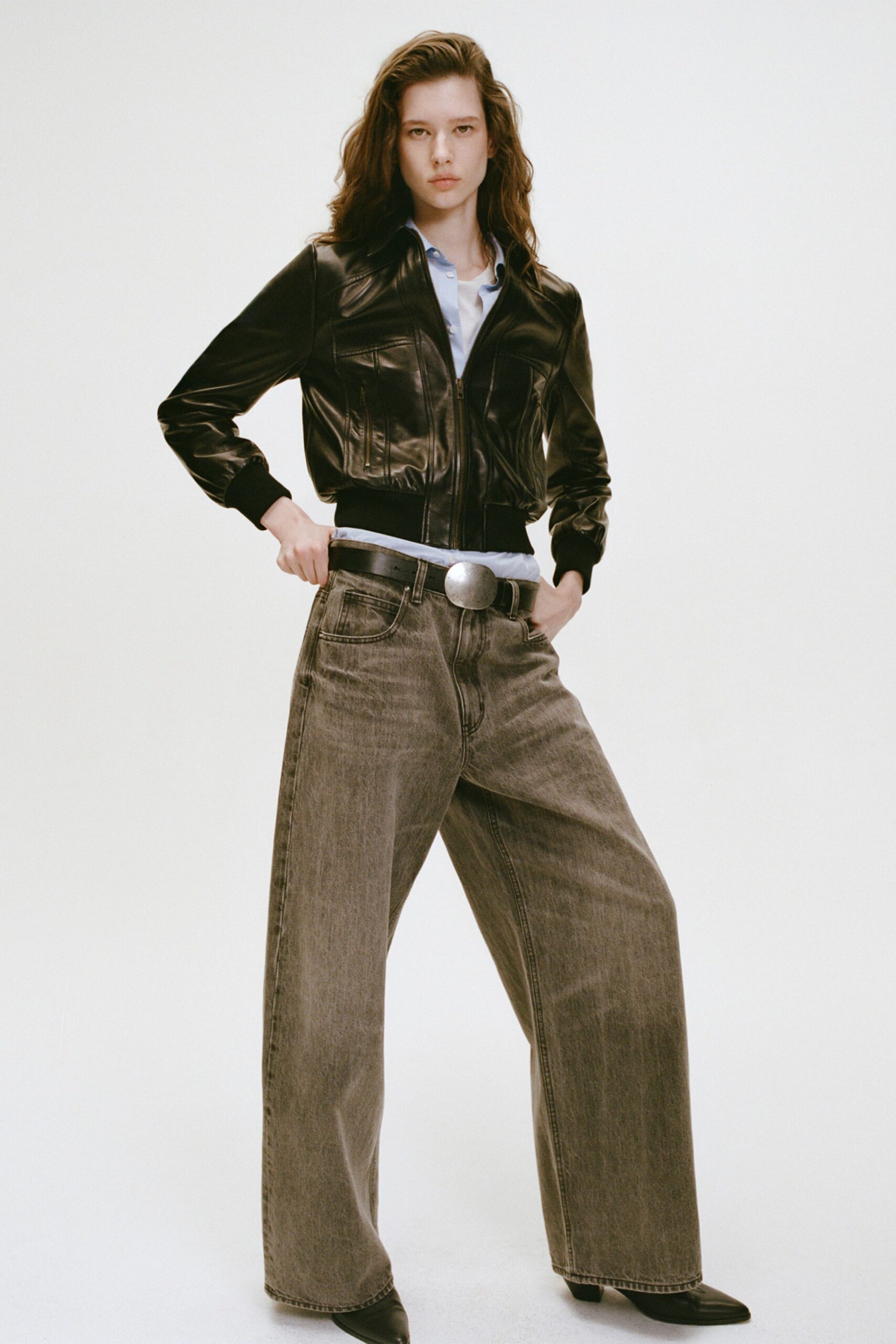 black leather jacket with wide-leg pants