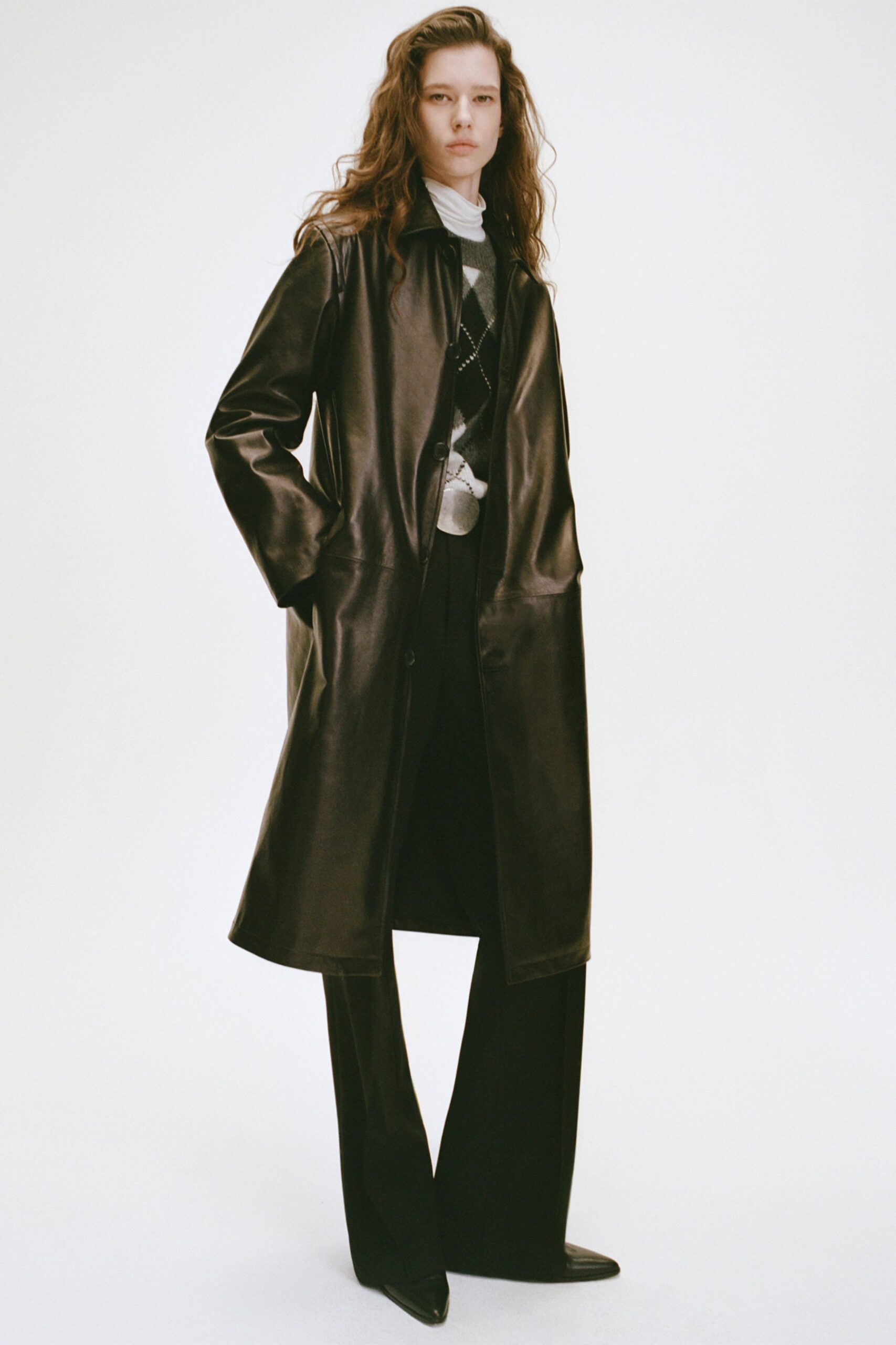 black leather coat with tailored pants