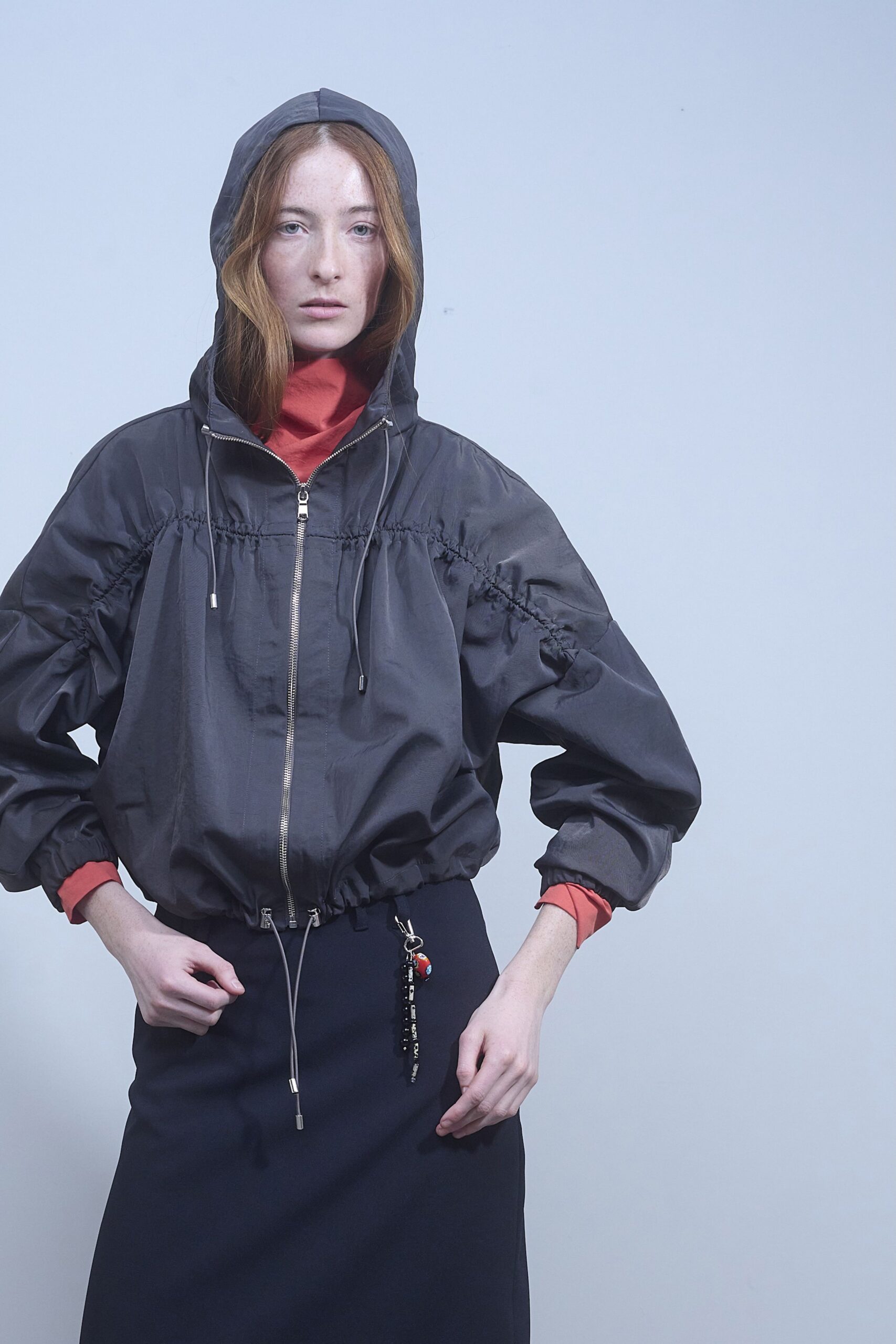 black jacket red top black skirt