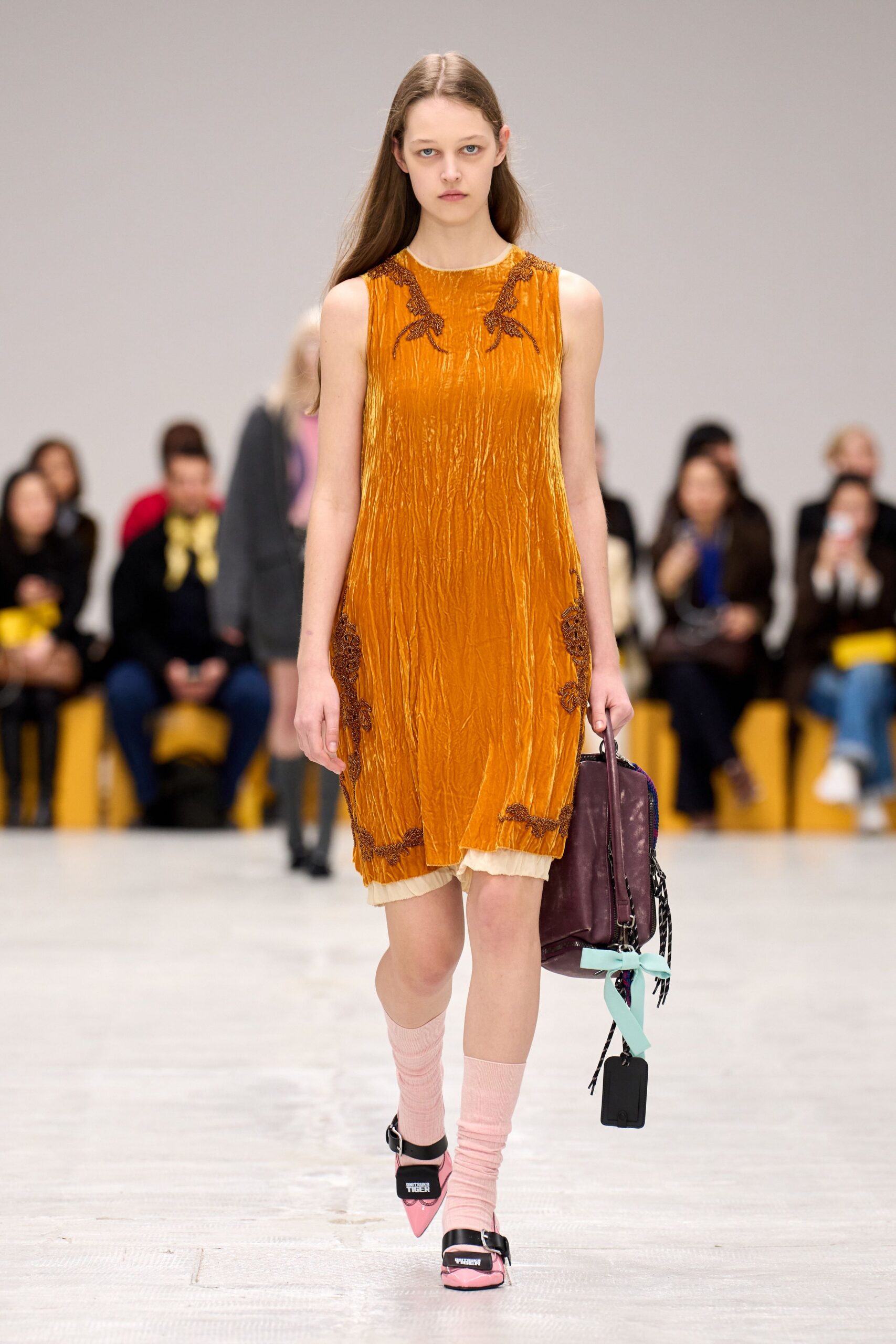 orange silk sleeveless high-neck fitted pleated shiny dress
