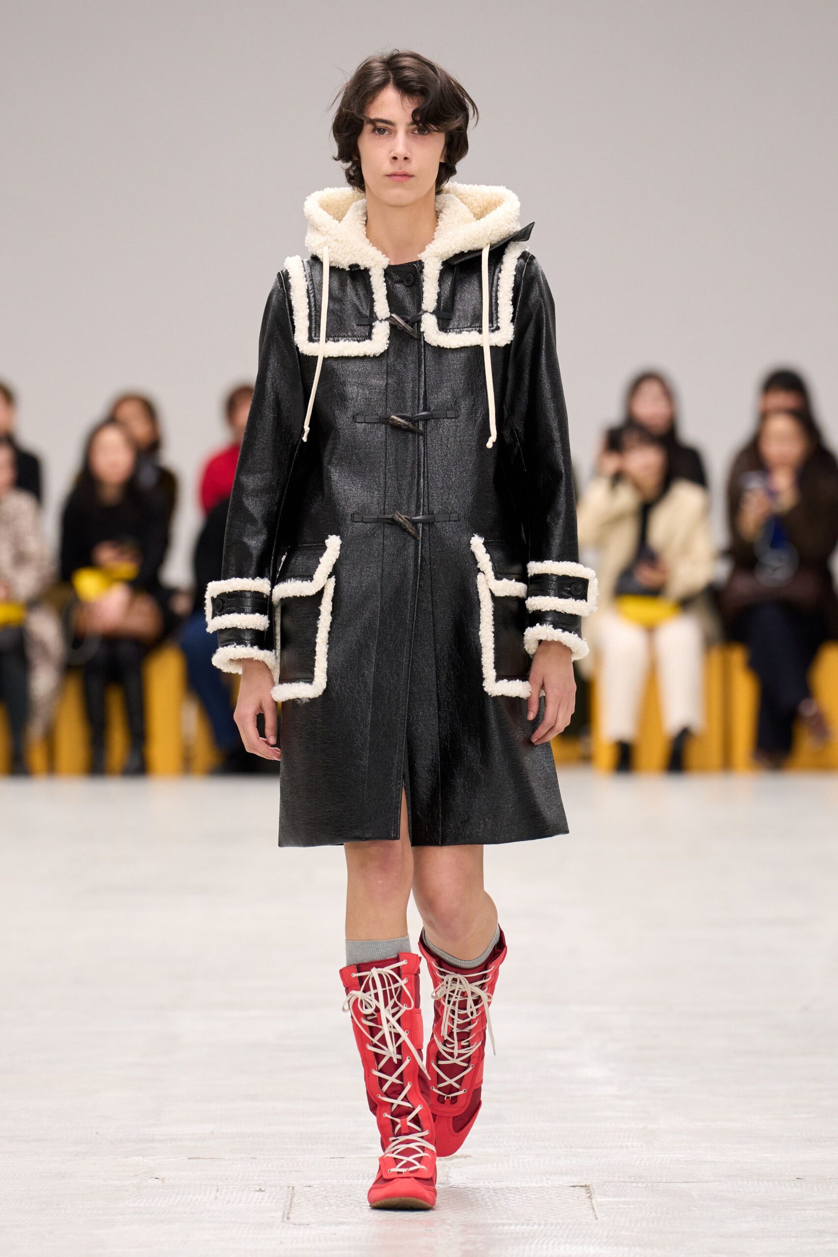 black leather long-sleeve hooded relaxed pockets zippered coat