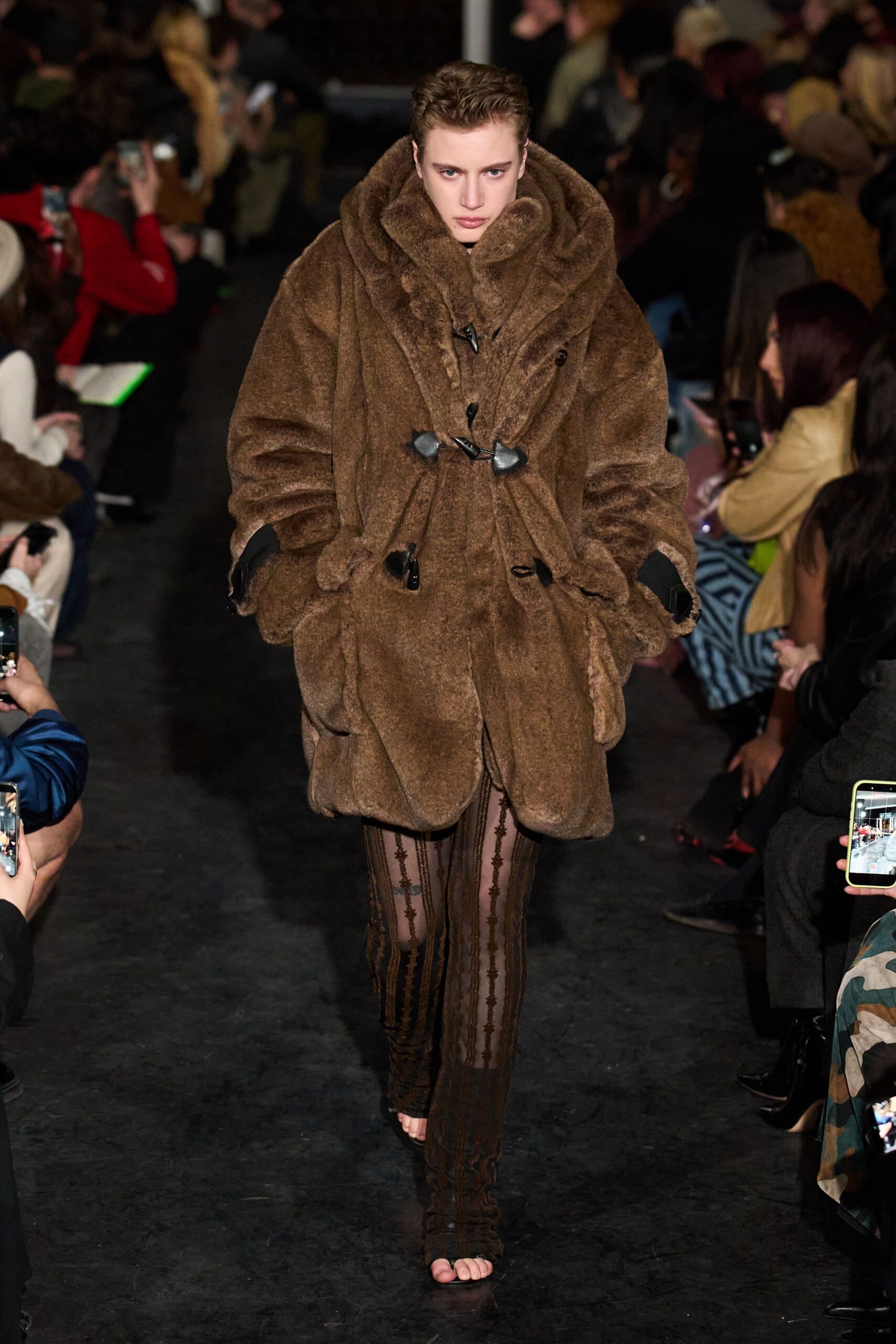brown faux-fur coat with black mesh pants