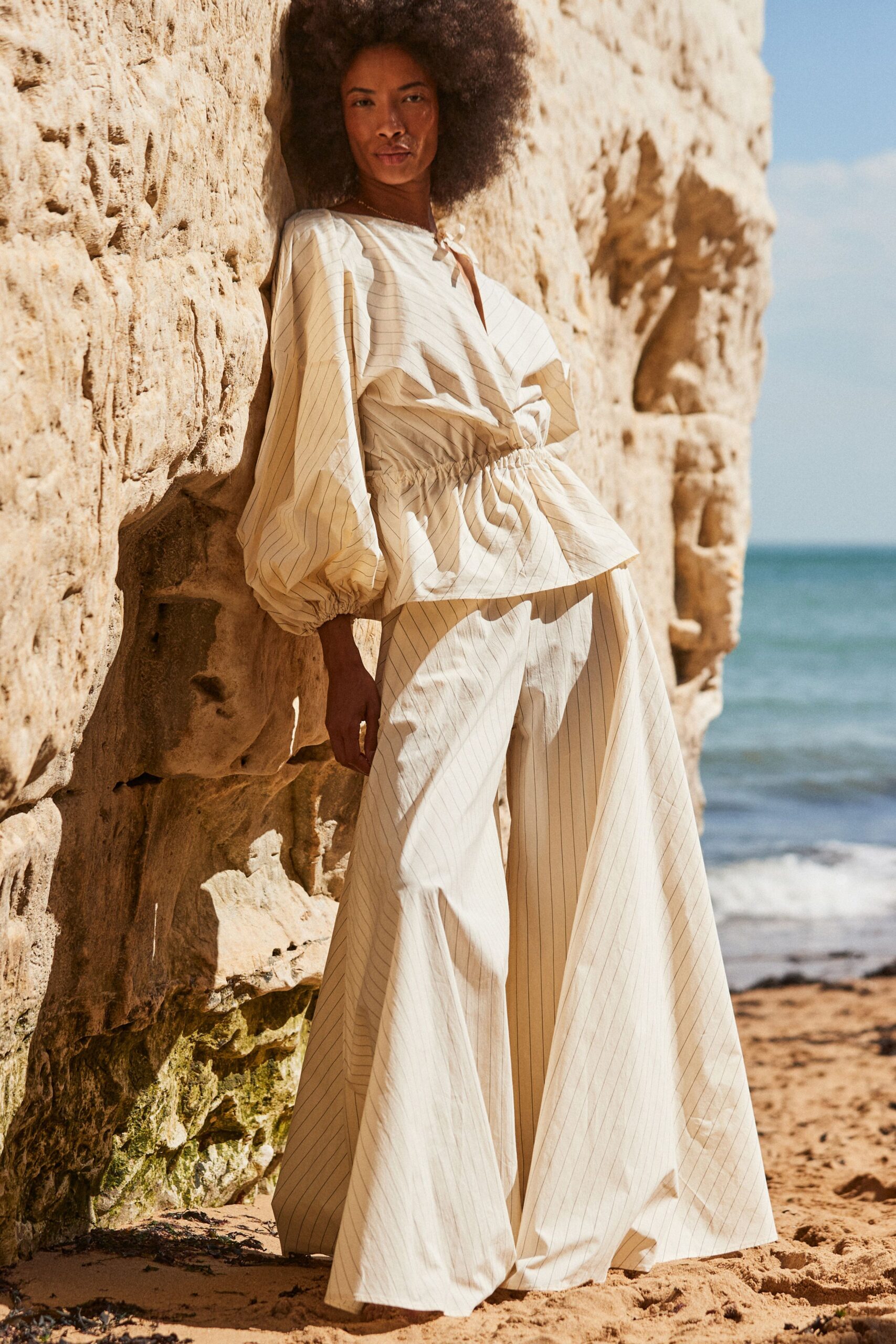 beige cotton long-sleeve v-neck relaxed pleated top