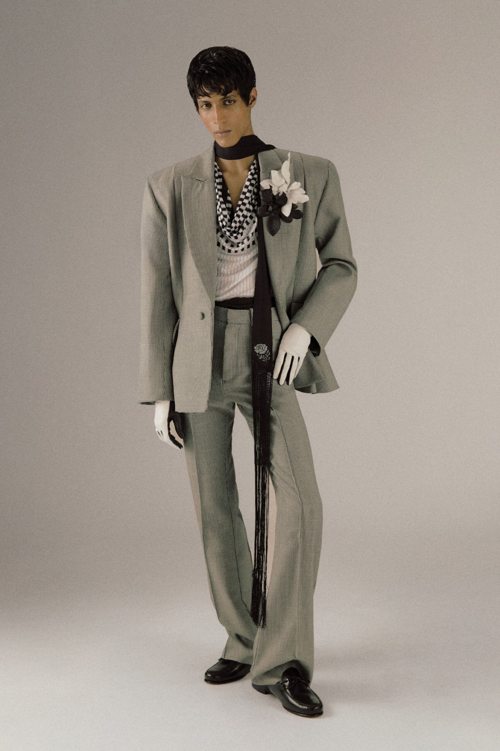 gray tailored suit with black shirt