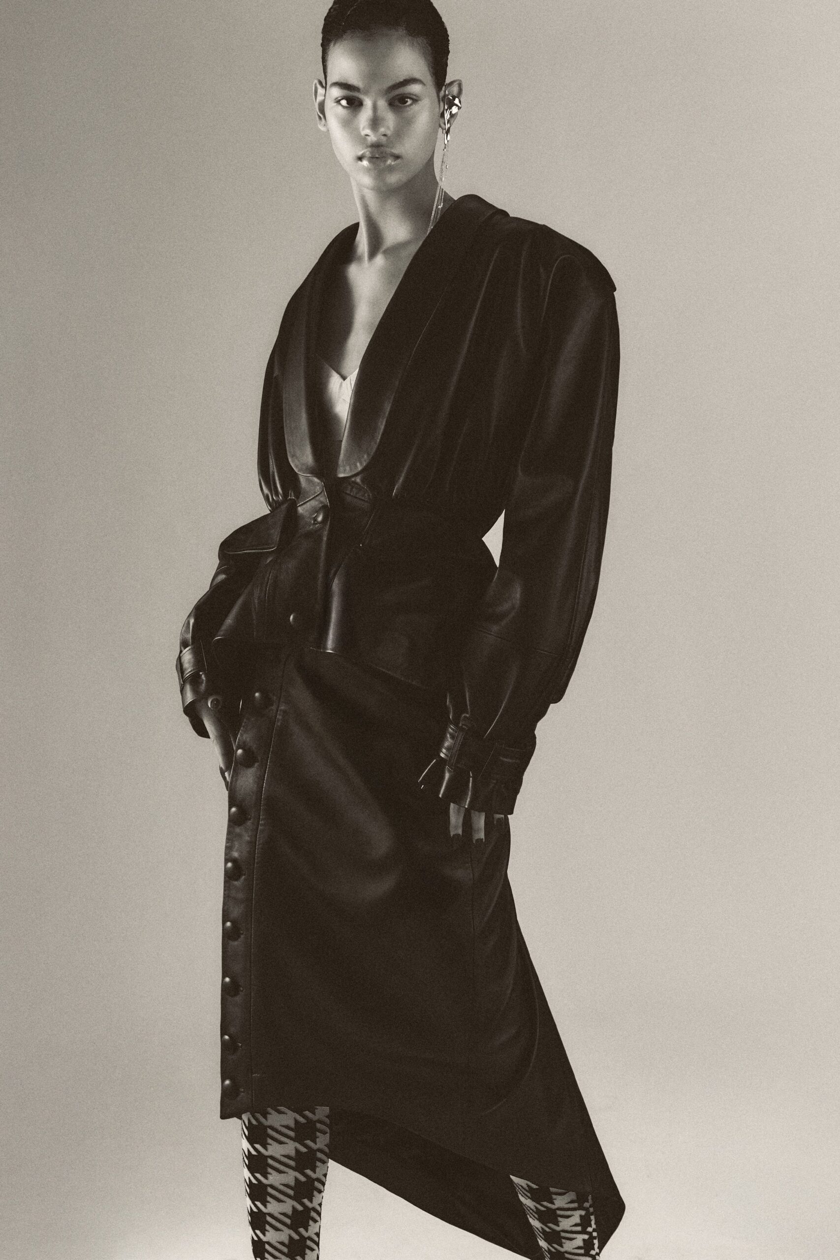 black leather coat with checked pants