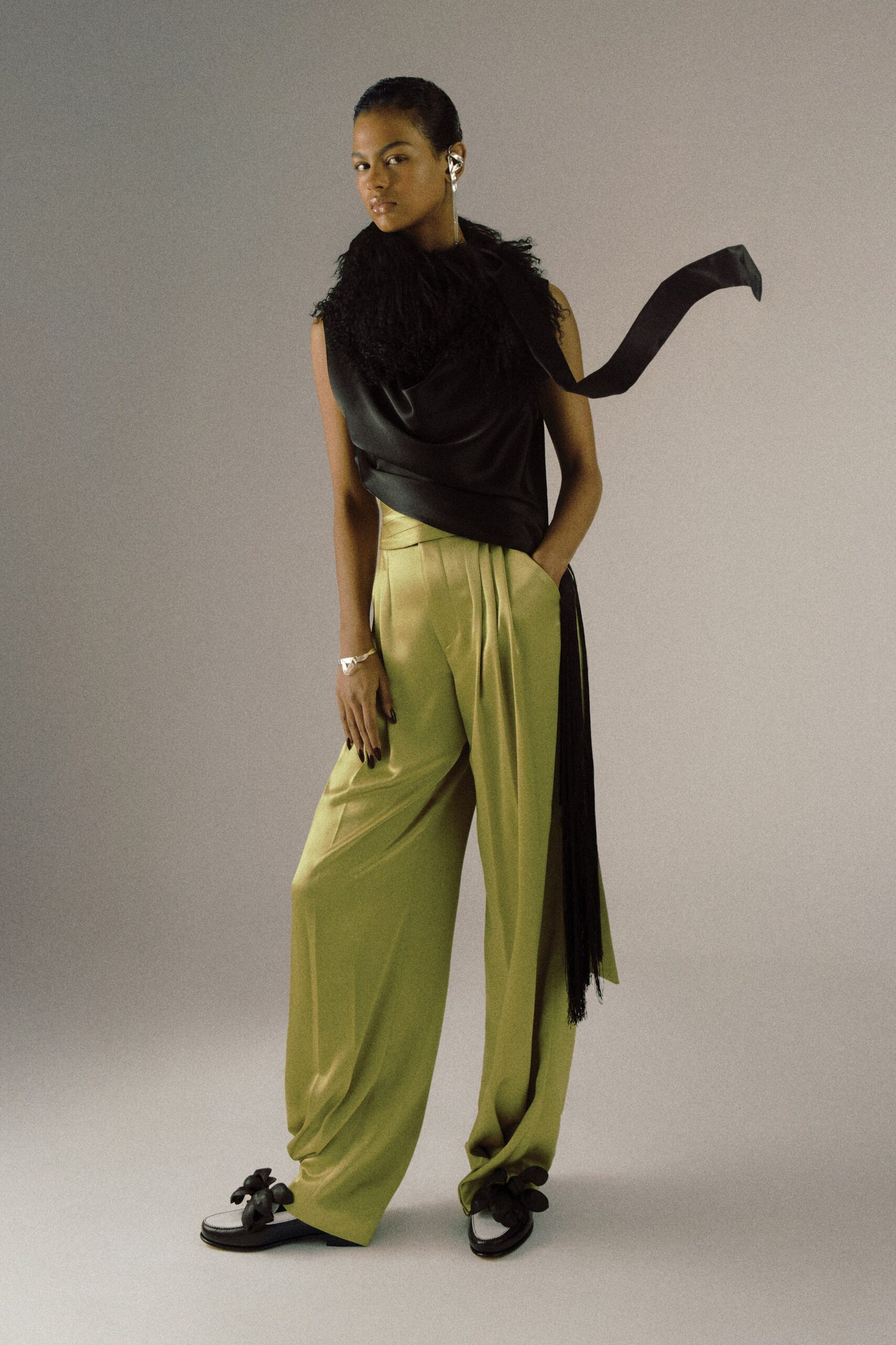 black silk top green pleated pants