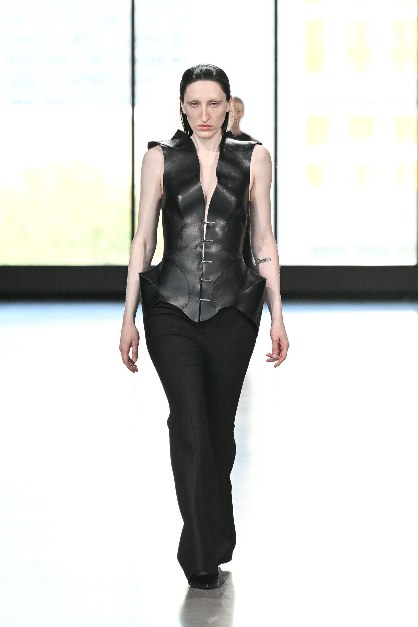 black leather sleeveless v-neck fitted structured top