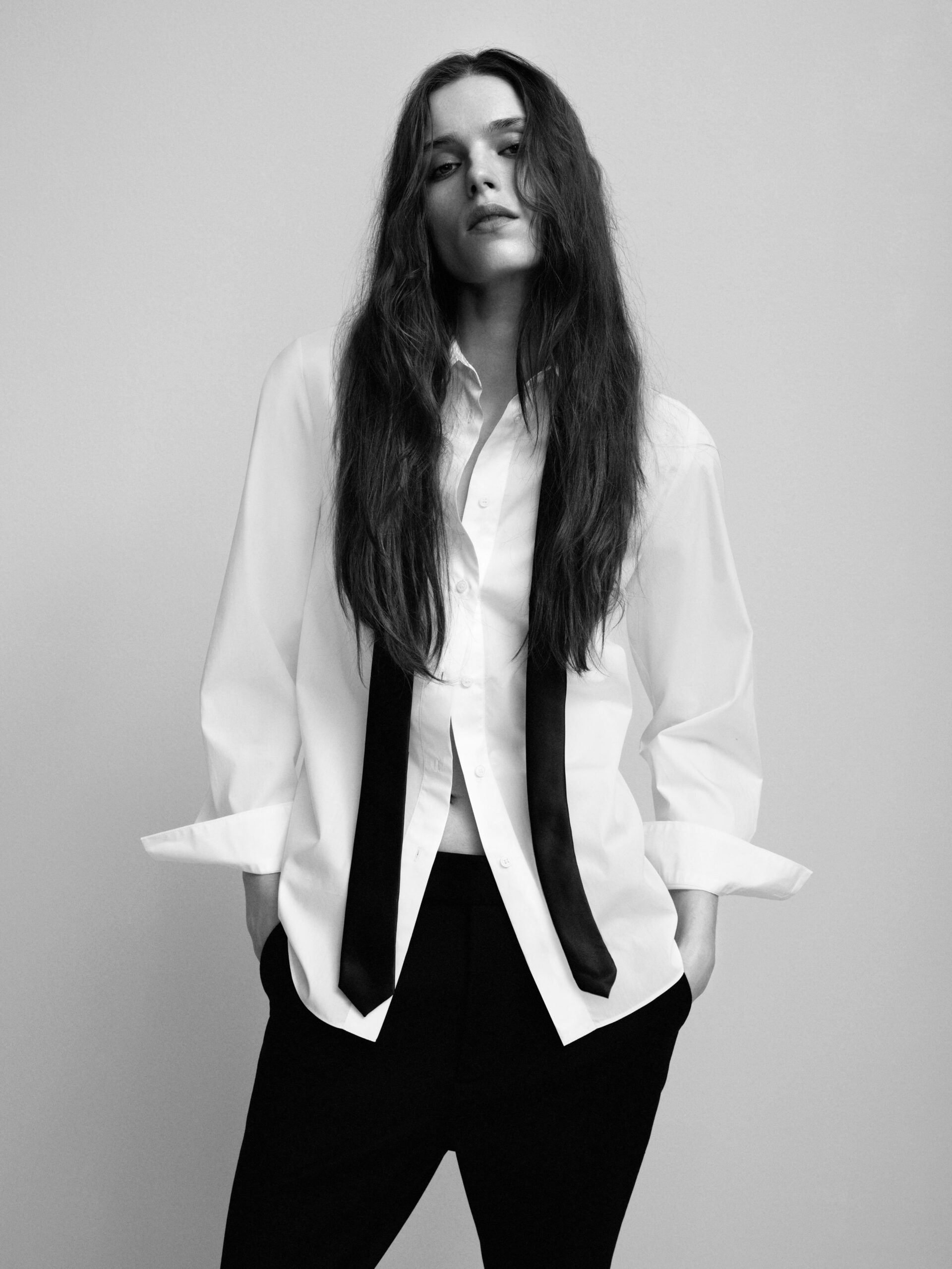 white relaxed shirt and black tailored pants