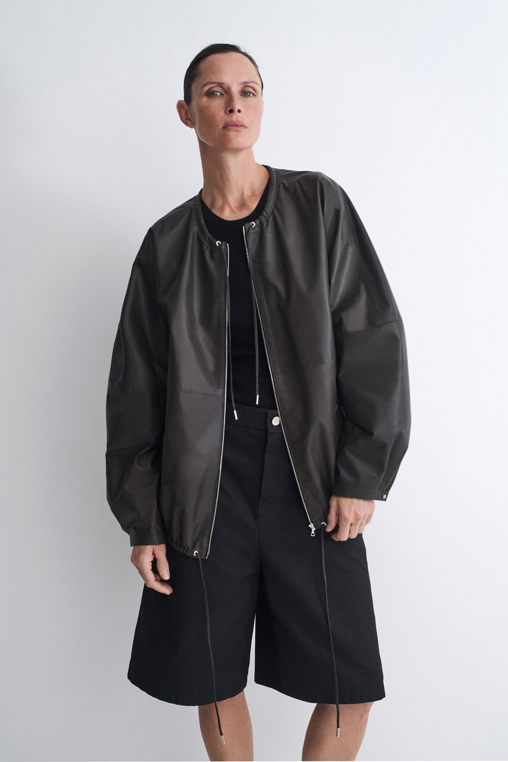 black leather long-sleeve collared oversized jacket