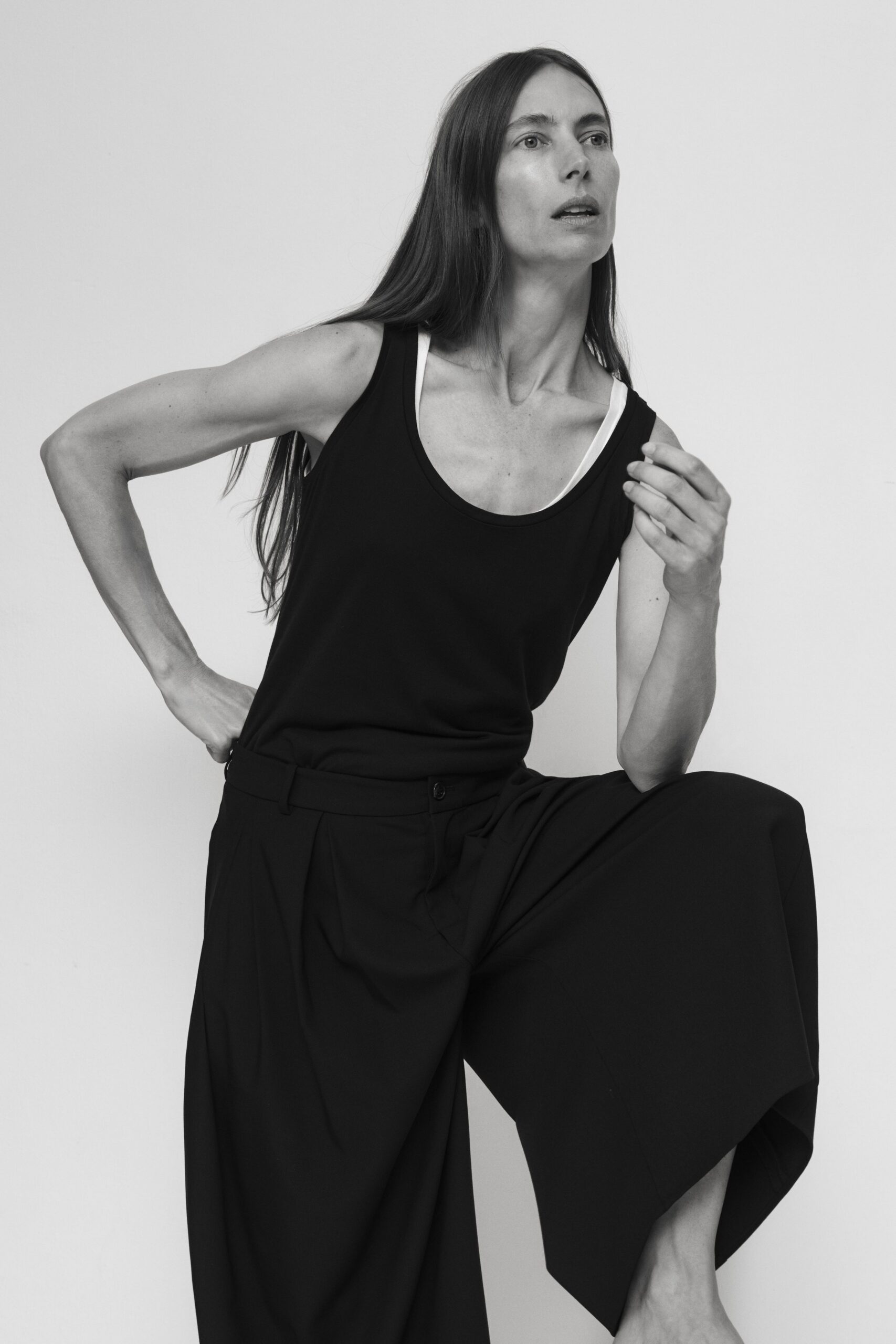 black tank-top and wide-leg pants